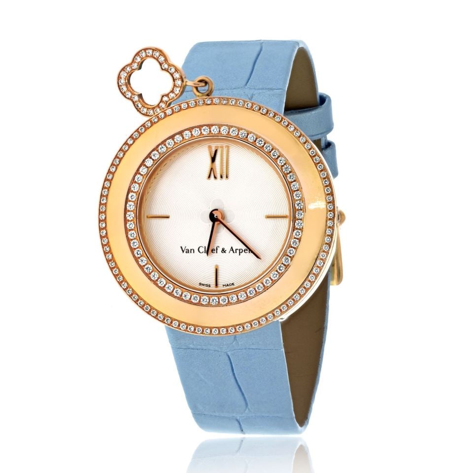 Van Cleef Arpels 18K Gold Diamond Charm Watch with Blue Alligator Strap 32mm: Van Cleef Arpels 18K Gold Diamond Charm Watch with Blue Alligator Strap 32mm This Van Cleef & Arpels charm watch features a 32mm case crafted in 18K yellow gold, paired with a blue alligator strap. Th