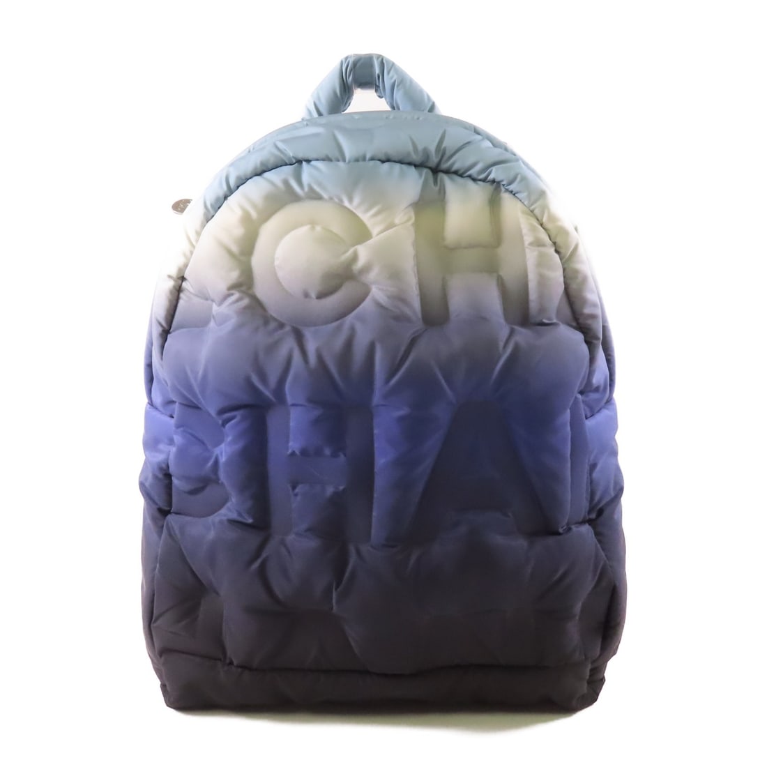 CHANEL CC SHW Doudoune Multicolor Nylon Rucksack Backpack A91933: CHANEL CC SHW Doudoune Multicolor Nylon Rucksack Backpack A91933 Introducing the CHANEL CC SHW Doudoune Backpack, a stylish and functional rucksack crafted from durable nylon. This multicolor bag feat