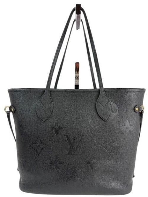 Neverfull MM Giant Monogram Black Empreinte Leather Tote by Louis Vuitton: Neverfull MM Giant Monogram Black Empreinte Leather Tote by Louis Vuitton This is a Louis Vuitton Neverfull MM tote crafted from black Empreinte leather with the signature Giant Monogram pattern. The