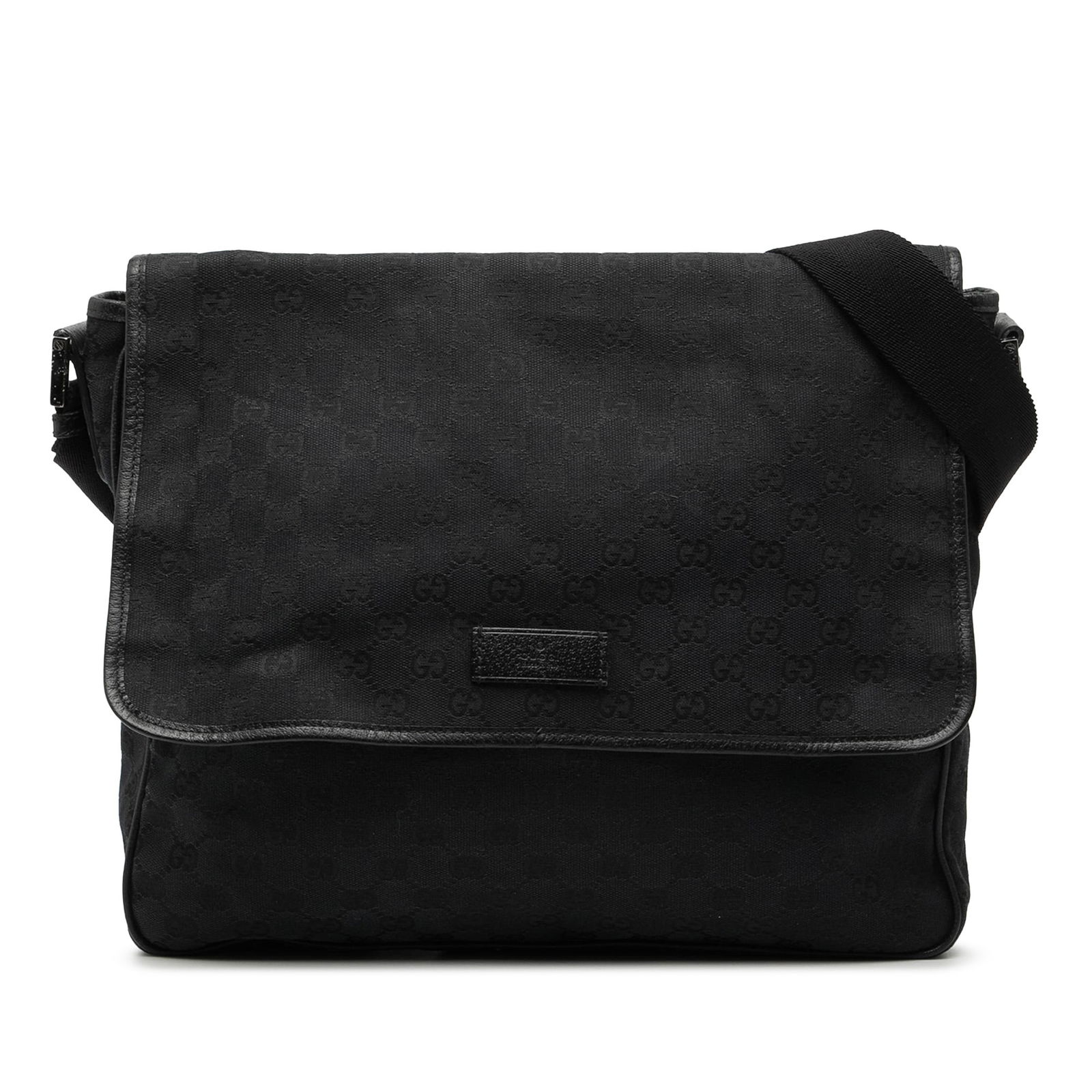 Black GG Canvas Flap Messenger Crossbody Bag by Gucci: Black GG Canvas Flap Messenger Crossbody Bag by Gucci This Gucci GG Canvas Flap Messenger Bag features a black canvas body with leather trim, an adjustable flat shoulder strap, a front flap closure, a