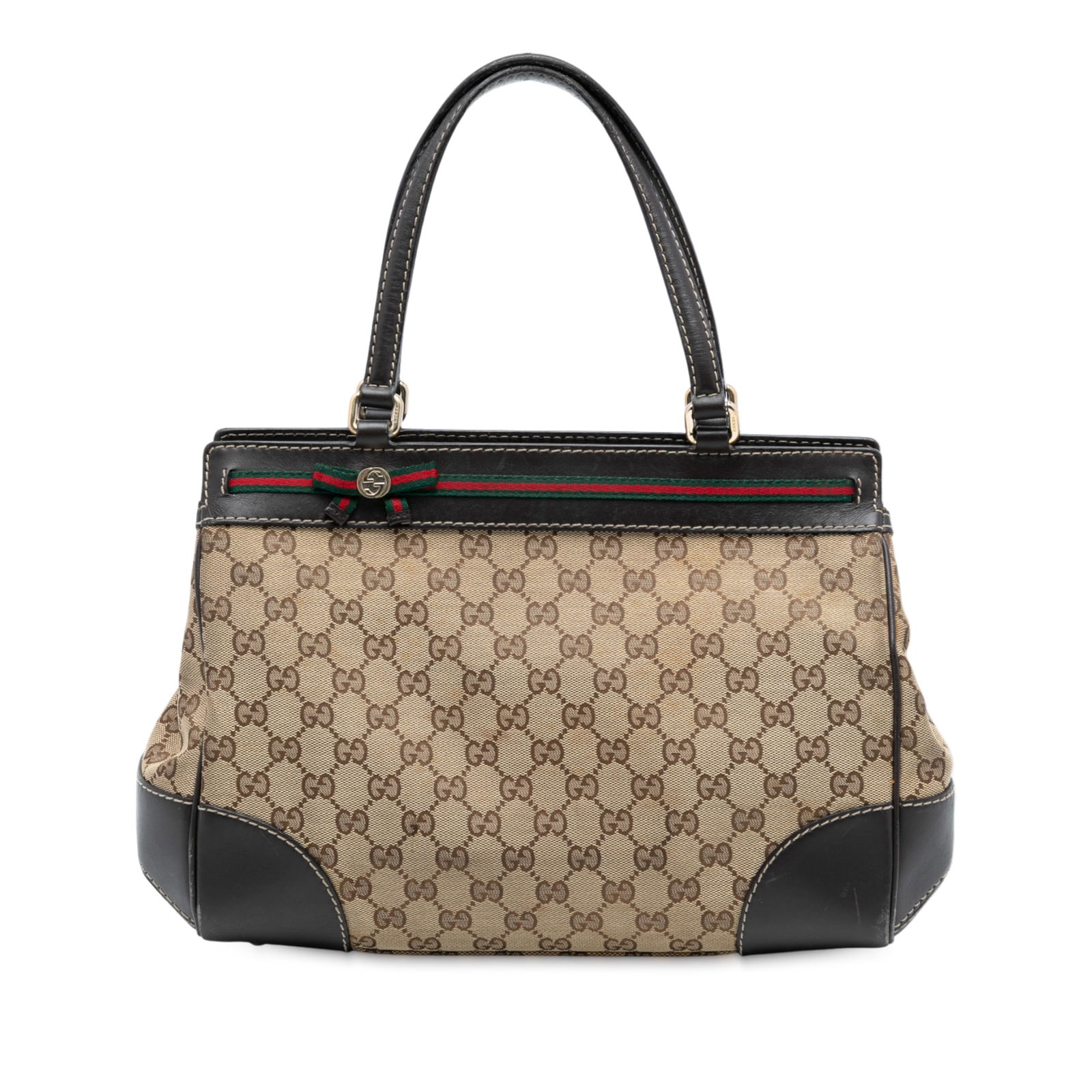 Brown Mayfair Canvas Tote Bag with Leather Trim by Gucci: Brown Mayfair Canvas Tote Bag with Leather Trim by Gucci The Gucci GG Canvas Mayfair Tote is crafted from durable canvas with leather trim and flat leather handles. It features a top zip closure, spac