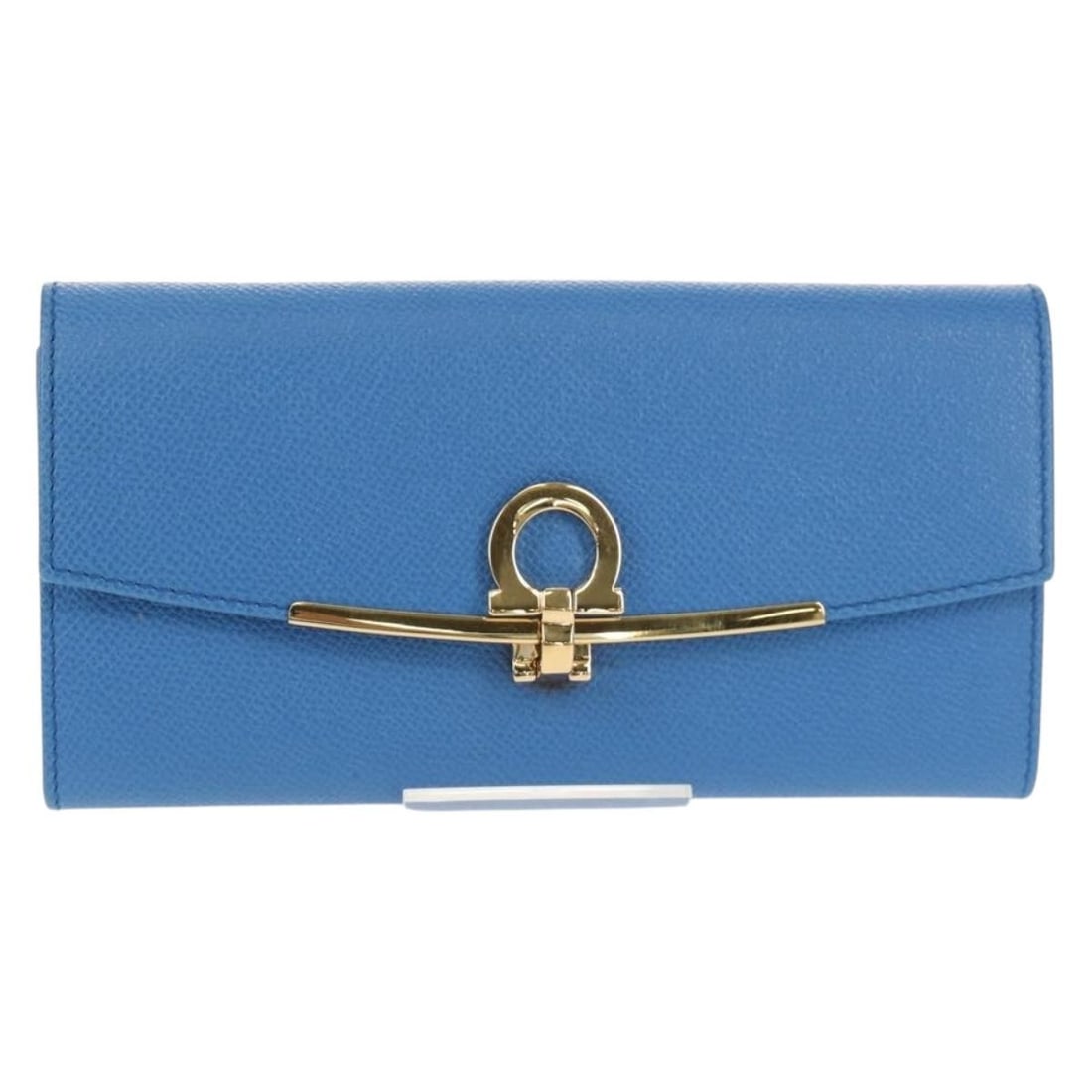 Blue Leather Gancini Flap Continental Wallet by Salvatore Ferragamo: Blue Leather Gancini Flap Continental Wallet by Salvatore Ferragamo This Salvatore Ferragamo Gancini Flap Continental Wallet is crafted from blue leather and designed for women. It features metal fitt