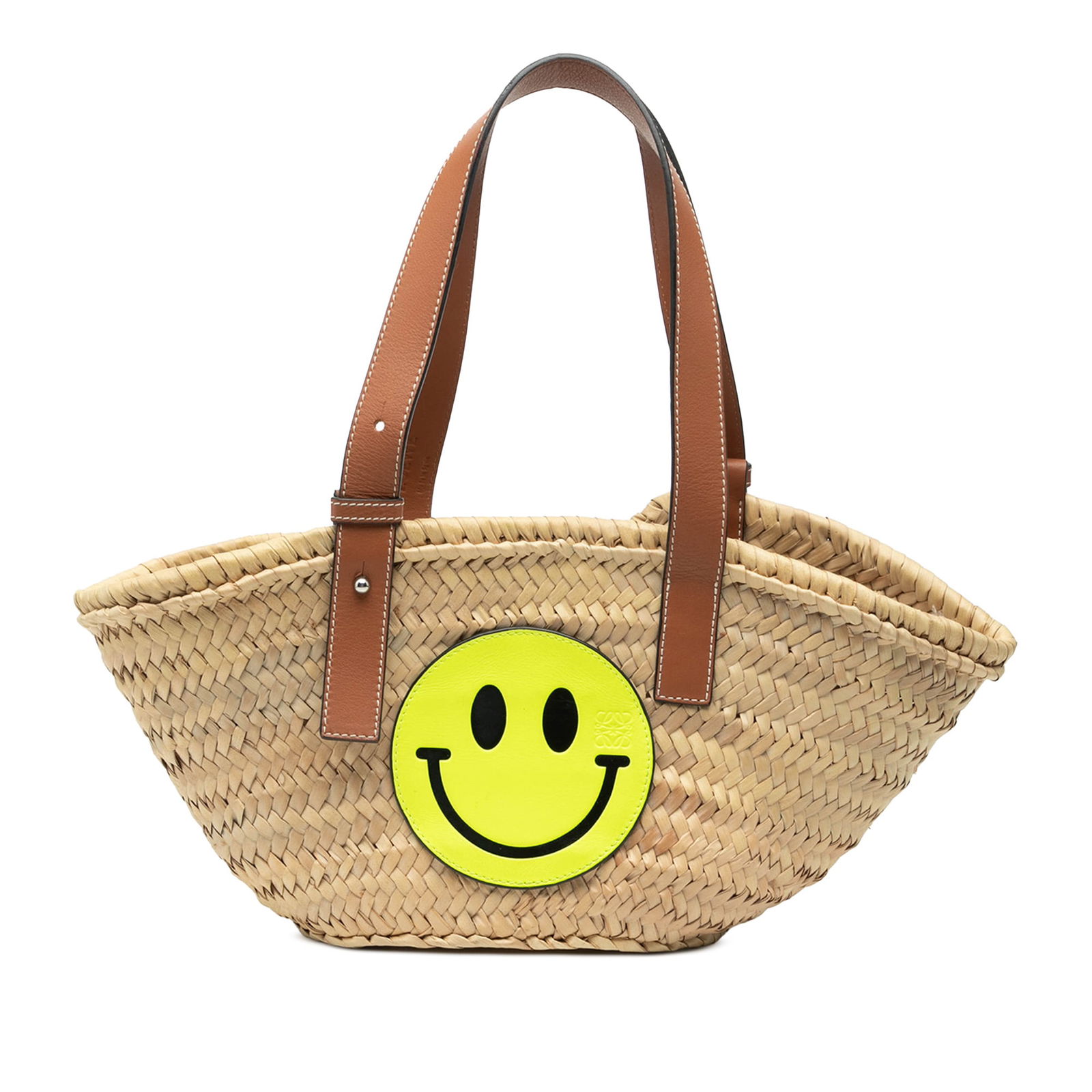 Paulas Ibiza Smiley Small Raffia Tote Bag by Loewe: Paulas Ibiza Smiley Small Raffia Tote Bag by Loewe This LOEWE Paula's Ibiza Smiley Small Raffia Basket Tote features a natural raffia body with an open top and adjustable flat leather handles. The bag