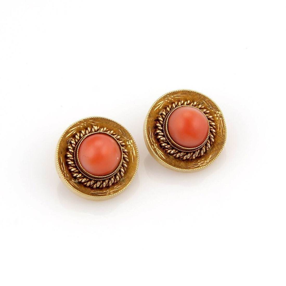 Pair of Vintage 18k Yellow Gold Clip Earrings with Coral Accents: Pair of Vintage 18k Yellow Gold Clip Earrings with Coral Accents These vintage stud earrings feature a fancy textured button design with coral accents, crafted from 18k yellow gold. The earrings are c