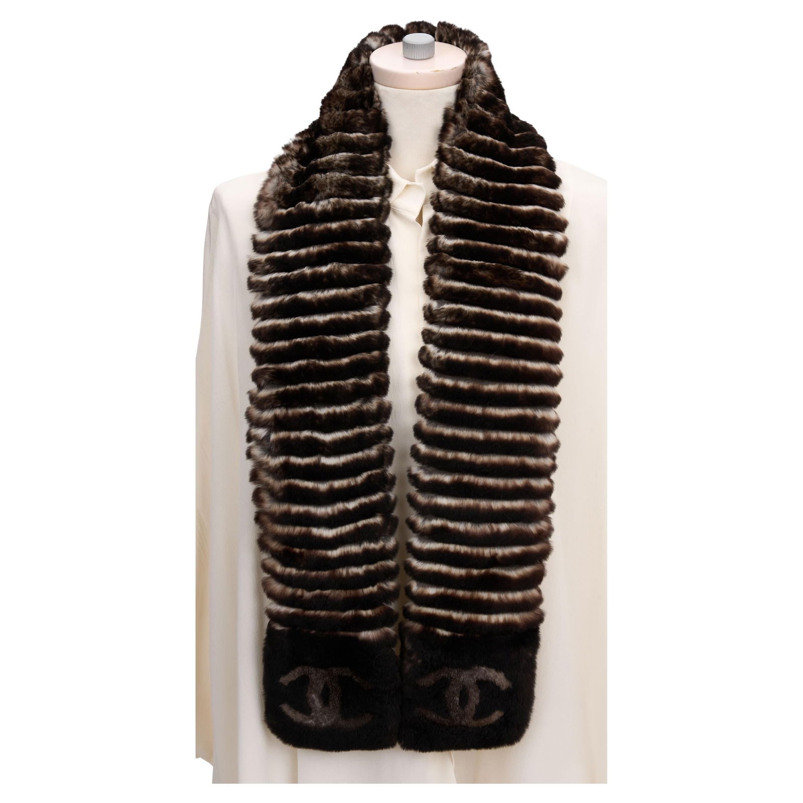 Chanel Orylag Fur Logo Scarf 57 x 5 inches: Chanel Orylag Fur Logo Scarf 57 x 5 inches Elevate your style with this exquisite Chanel Orylag Fur Brown Logo Scarf. Crafted from high-quality Orylag fur, this luxurious scarf features the iconic CC