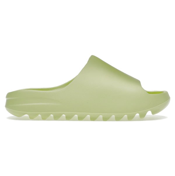 Yeezy Slide by Adidas in Glow Green Size 13 Men's 14.5 Women's: Yeezy Slide by Adidas in Glow Green Size 13 Men's 14.5 Women's This is an authentic Adidas Yeezy Slide in Glow Green, presented in un-used and unworn condition. The slide is available in size 13 for m