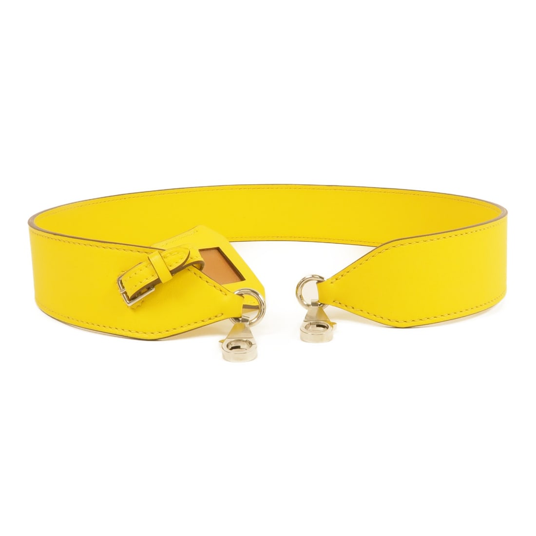 HERMES Yellow Swift Leather Shoulder Strap with PHW: HERMES Yellow Swift Leather Shoulder Strap with PHW This elegant shoulder strap from HERMES is crafted from high-quality calfskin leather in a vibrant yellow hue. Designed for versatility, it enhances