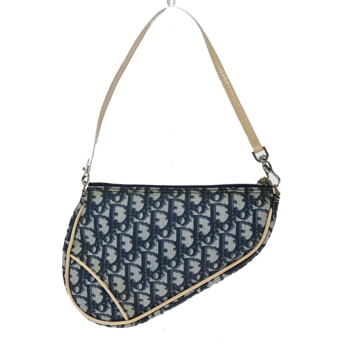 Christian Dior Diorissimo Coated Canvas Blue Saddle Bag 23cm: Christian Dior Diorissimo Coated Canvas Blue Saddle Bag 23cm This vintage Christian Dior Saddle Bag for women features Diorissimo coated canvas in blue with PVC material. The bag measures 23cm x 16cm