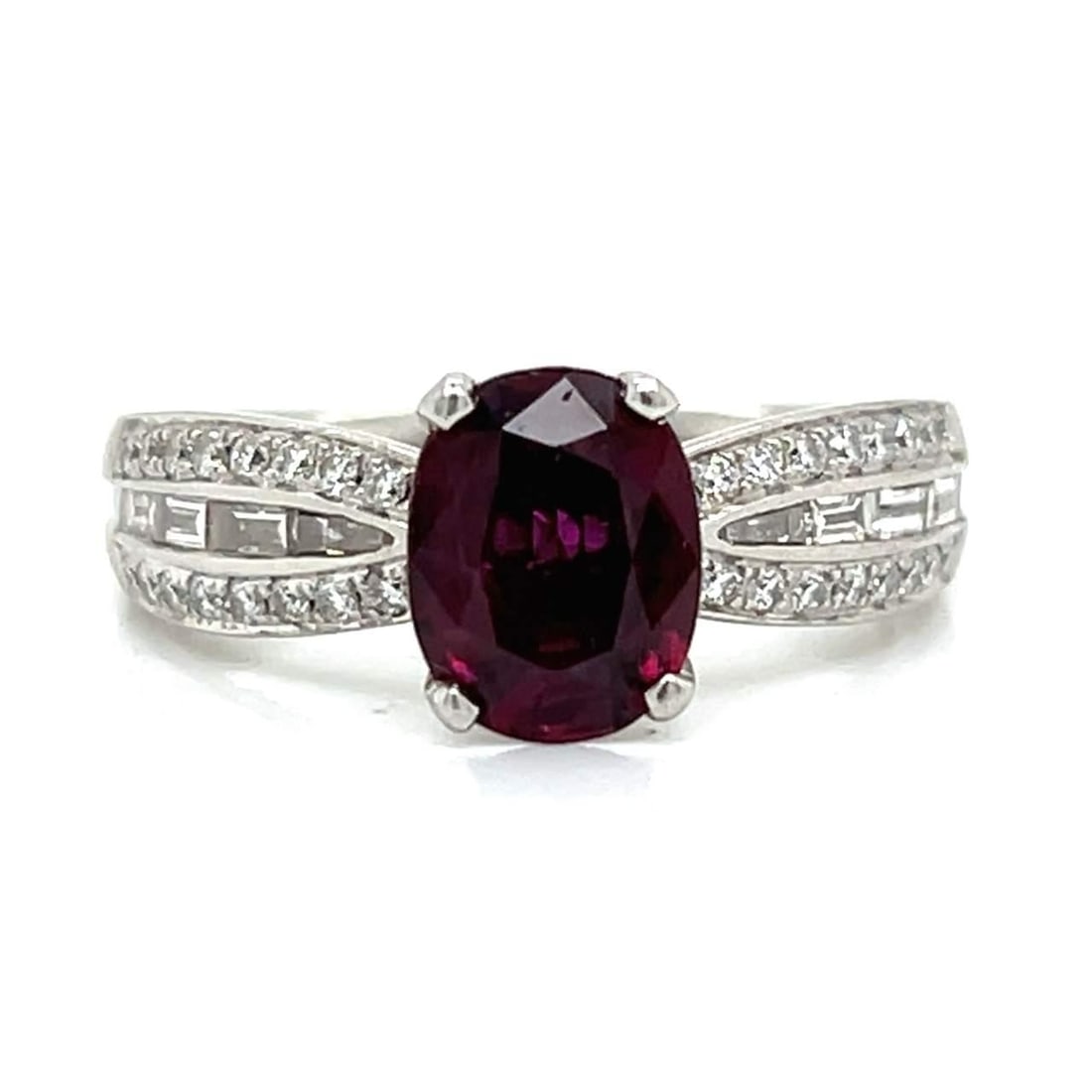 Platinum 2.00 Ct Ruby & 44 Diamond Ring F-G VVS-VS: Platinum 2.00 Ct Ruby & 44 Diamond Ring F-G VVS-VS This exquisite Platinum ring showcases a stunning 2.00 Ct. Ruby, beautifully complemented by a total of 44 sparkling Diamonds. The ring features 36 D