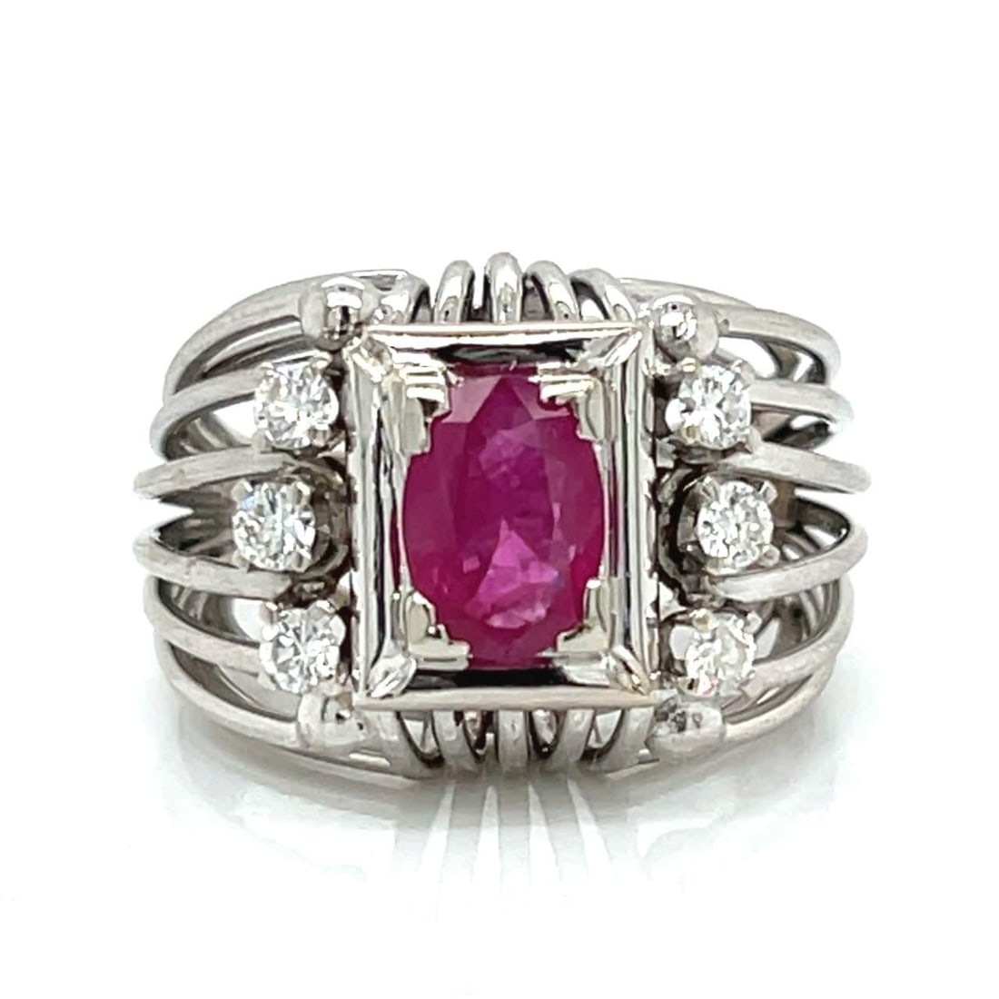 GIA Certified 1.12 Ct Burma Ruby Diamond Ring in 18K White Gold: GIA Certified 1.12 Ct Burma Ruby Diamond Ring in 18K White Gold This exquisite ring features a stunning GIA Certified 1.12 Ct. Burma Ruby set in luxurious 18K white gold. The ruby is complemented by s