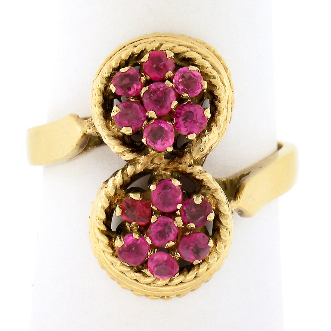 Vintage 18k Yellow Gold Ruby Flower Cluster Bypass Ring: Vintage 18k Yellow Gold Ruby Flower Cluster Bypass Ring This stunning vintage bypass ring is crafted from solid 18k yellow gold and showcases a unique dual swirl design with elegant twisted wire work.