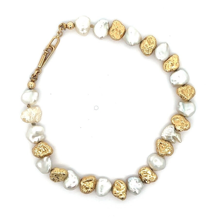 13k Yellow Gold Baroque Pearl Nugget Beads Bracelet 7": 13k Yellow Gold Baroque Pearl Nugget Beads Bracelet 7" This exquisite bracelet features a stunning combination of 15 genuine cultured white baroque pearls and 11 solid gold free form nugget beads, all