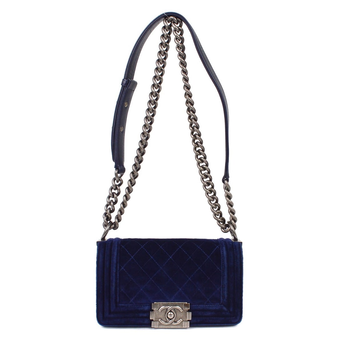 Navy Velvet Chanel Boy Small Chain Shoulder Bag: Navy Velvet Chanel Boy Small Chain Shoulder Bag This Chanel Boy Flap Bag features a quilted navy velvet exterior and a small chain shoulder strap. Designed for women, it is crafted in Italy and