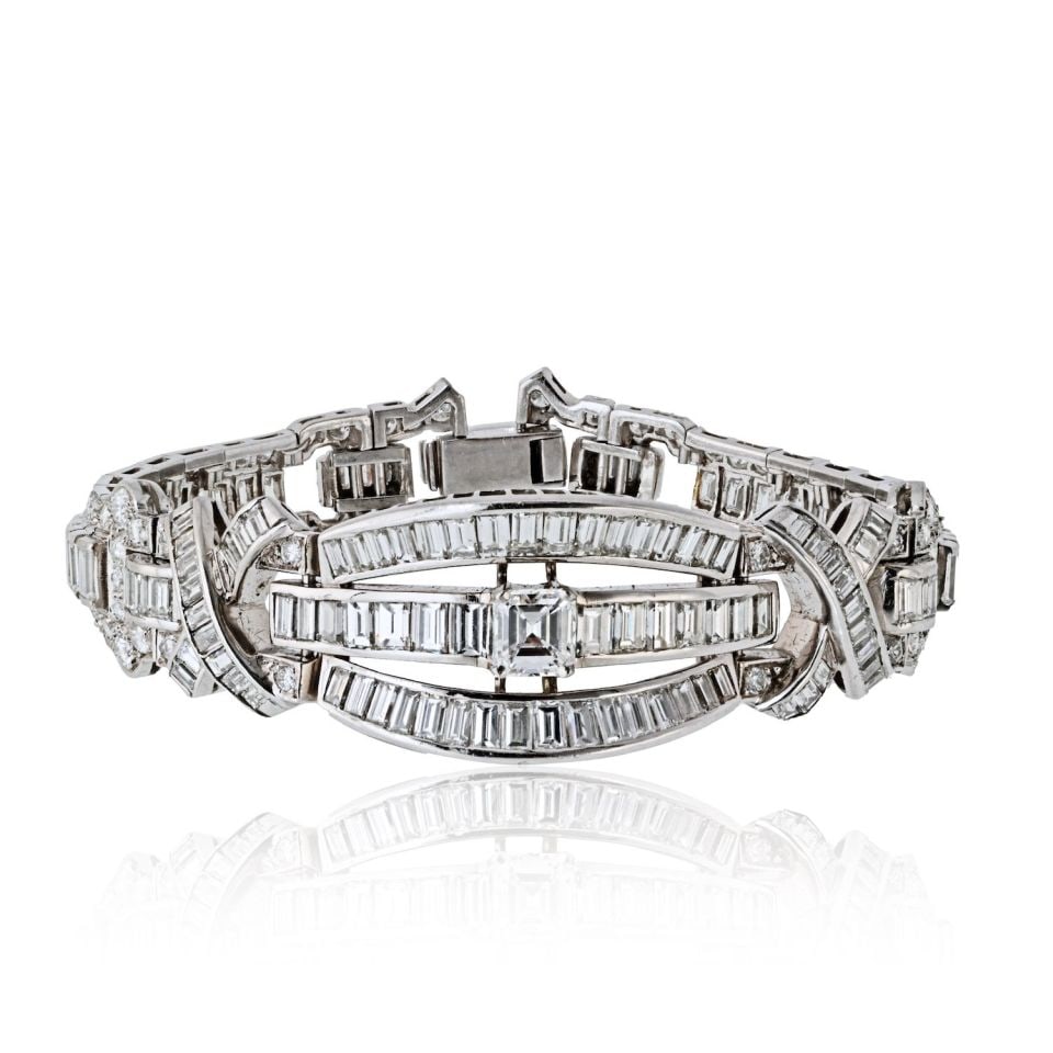 1960s Platinum Diamond Bracelet 21 Cts Art Deco Design: 1960s Platinum Diamond Bracelet 21 Cts Art Deco Design This stunning Platinum Diamond Bracelet is a remarkable piece of mid-century jewelry, dating back to the 1960s. Handcrafted from luxurious platin