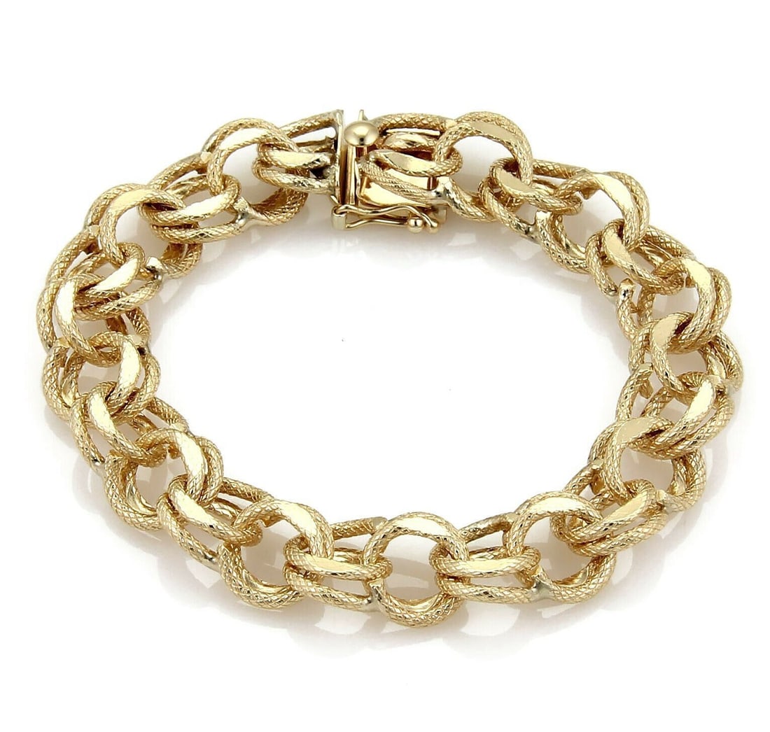 Vintage 14k Yellow Gold Double Round Link Bracelet 12mm Wide 7.5 Inch: Vintage 14k Yellow Gold Double Round Link Bracelet 12mm Wide 7.5 Inch This vintage bracelet features a textured double round link design, expertly crafted from solid 14k yellow gold. Measuring 7.5 inc