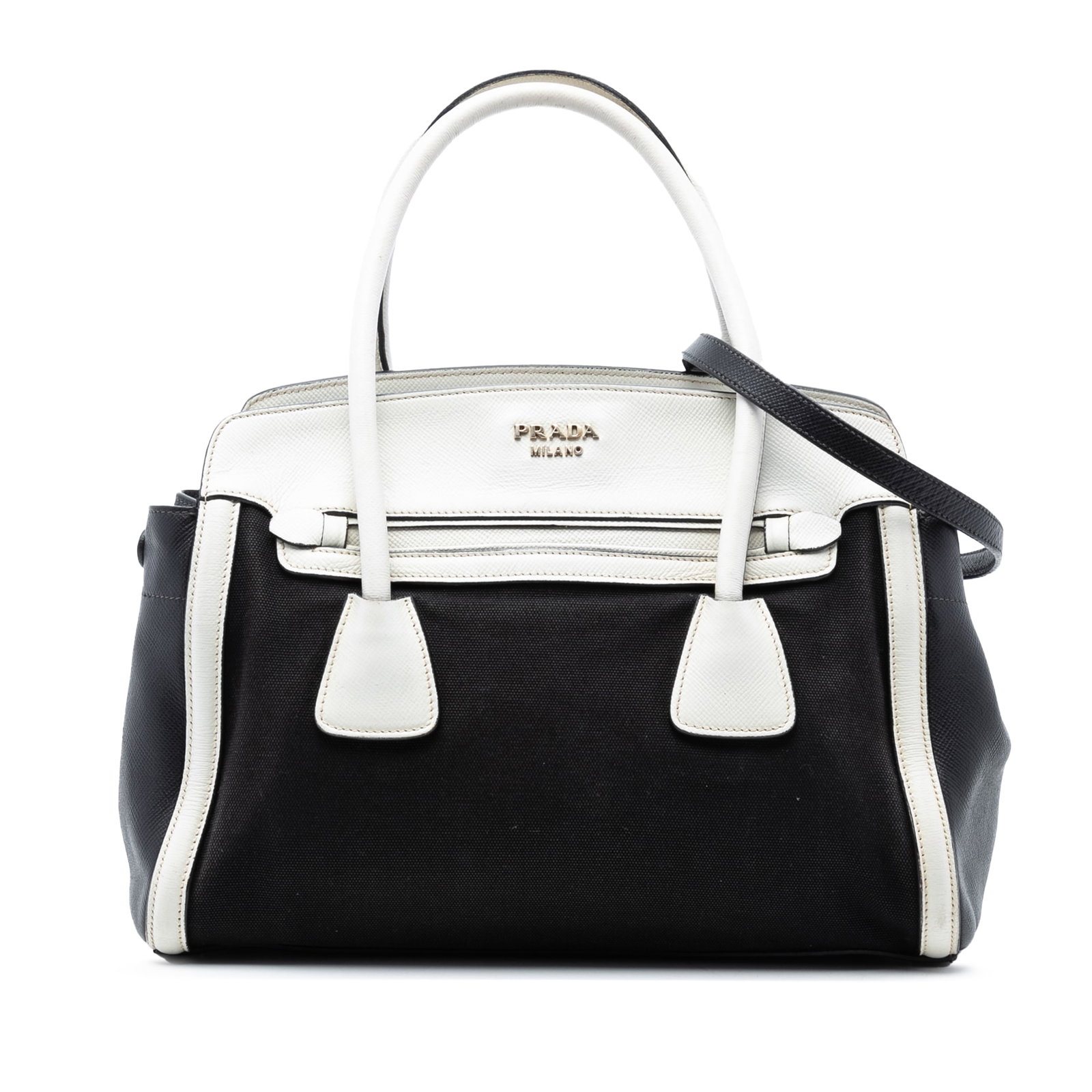 Prada Canvas Satchel with Saffiano Leather Trim and Detachable Strap: Prada Canvas Satchel with Saffiano Leather Trim and Detachable Strap This Prada Bicolor Saffiano Cuir Trimmed Canvas Satchel features a canvas body with Saffiano leather trim, rolled leather handles,