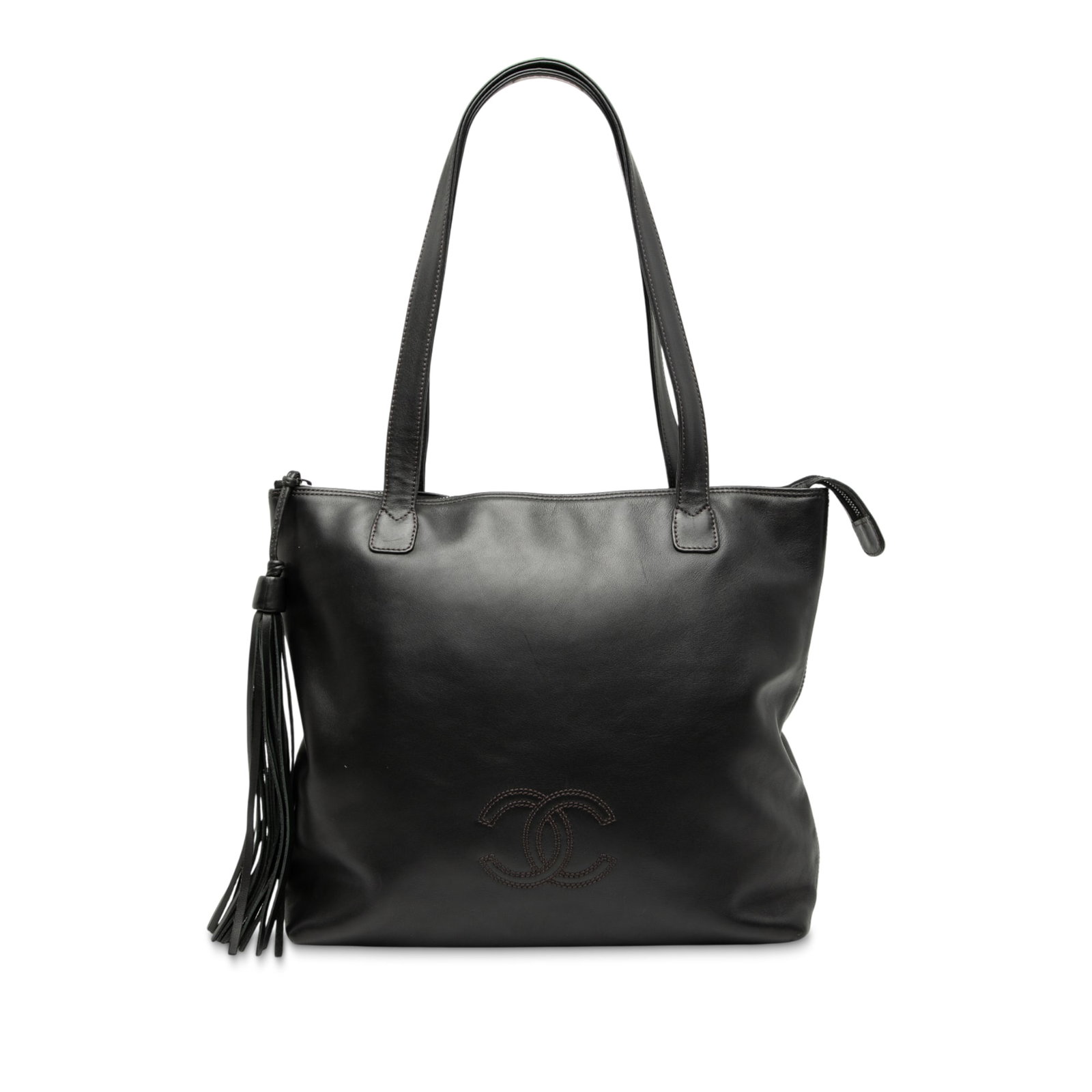 Black Chanel Lambskin Leather Tote with CC Logo and Tassel Detail: Black Chanel Lambskin Leather Tote with CC Logo and Tassel Detail This Chanel CC Lambskin Tassel Tote features a black leather body with a tassel detail, flat leather shoulder straps, a top zip closur