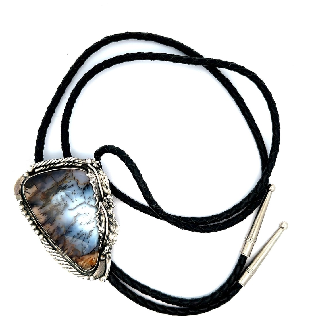 Sterling Silver Bolo Tie with Mossy Agate Cabochon by Stan D on Black Leather: Sterling Silver Bolo Tie with Mossy Agate Cabochon by Stan D on Black Leather This vintage bolo tie features a custom bezel-set, natural mossy agate cabochon with greyish blue tones and natural white