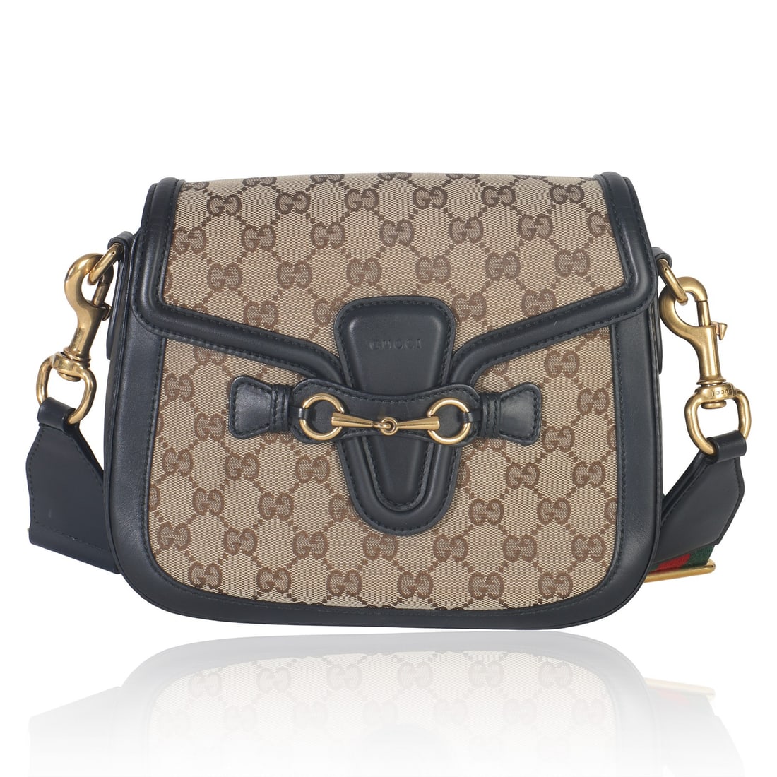 Gucci Medium Lady Web Shoulder Bag in Black and Beige Canvas: Gucci Medium Lady Web Shoulder Bag in Black and Beige Canvas This Gucci Medium Lady Web shoulder bag features black and beige GG canvas with gold-tone hardware and a flap top closure. The medium-sized
