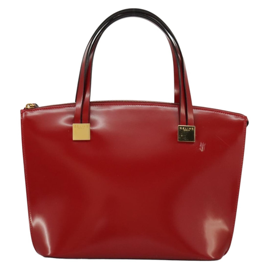 Red Patent Leather Celine Woman's Handbag 26cm by 22cm by 13cm: Red Patent Leather Celine Woman's Handbag 26cm by 22cm by 13cm This Celine handbag is crafted from red patent leather, designed for female users. It features a structured silhouette with notable signs