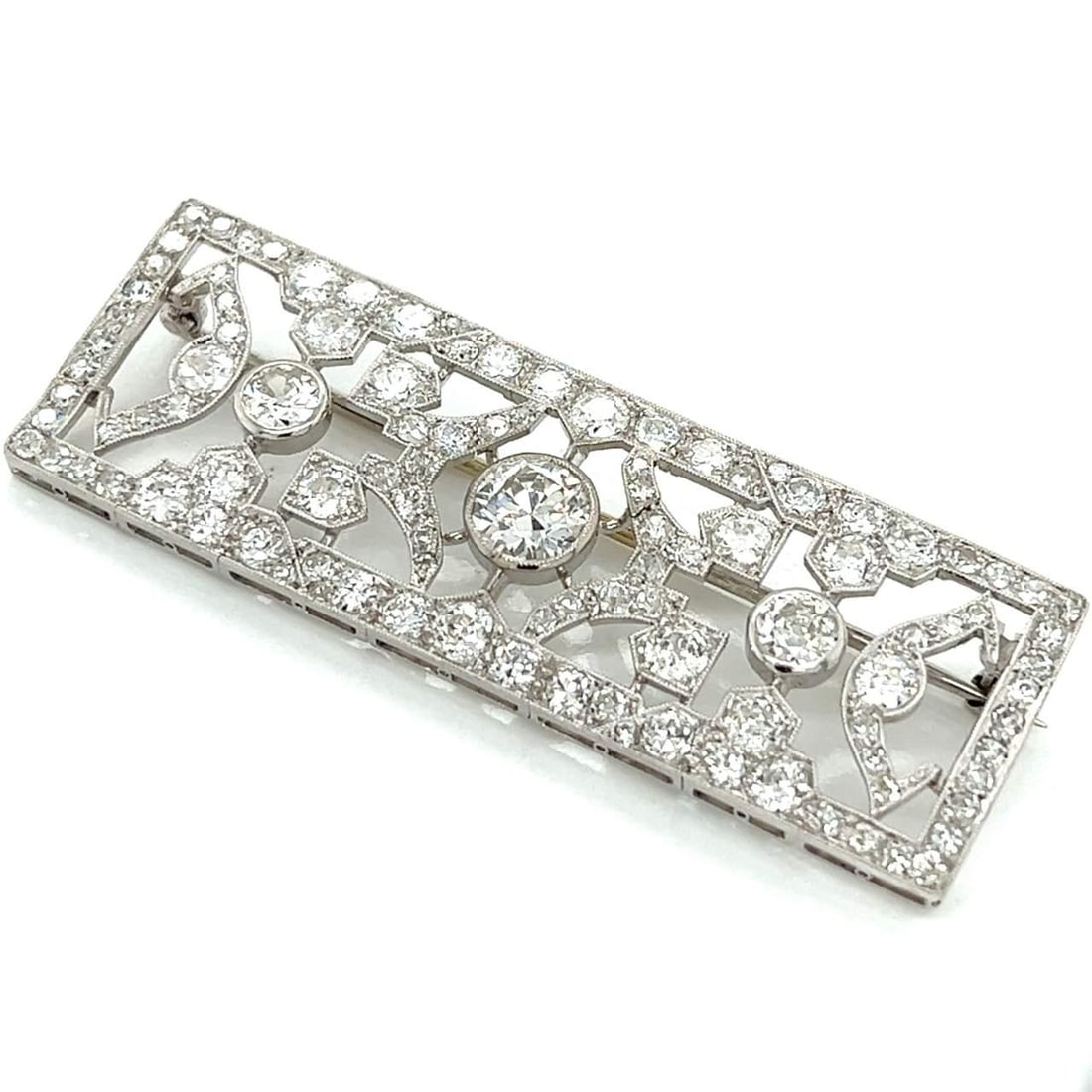 Art Deco Platinum Brooch with 8.60 Ct Diamonds I Color SI1 Clarity: Art Deco Platinum Brooch with 8.60 Ct Diamonds I Color SI1 Clarity This exquisite Art Deco brooch showcases a stunning design crafted in platinum. The centerpiece features an approximately 1.60 Ct. di