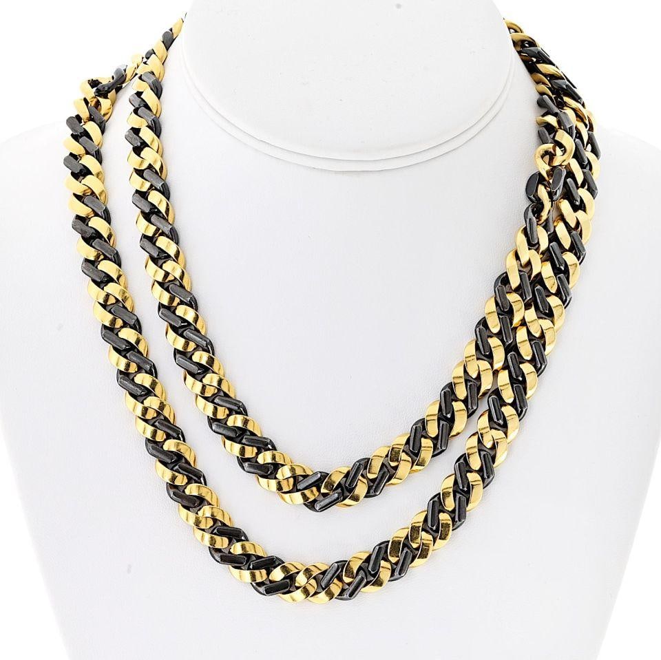 Bvlgari 18K Yellow Gold Curb Link Necklace 34 Inches: Bvlgari 18K Yellow Gold Curb Link Necklace 34 Inches This exquisite 34-inch necklace from Bvlgari showcases bold curb links expertly crafted in 18K yellow gold, complemented by blackened silver for a
