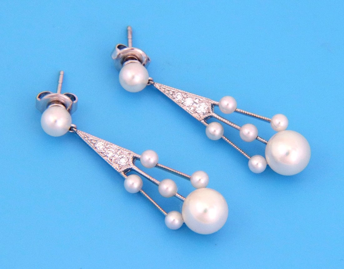 18k White Gold Drop Earrings with Pearls and Diamonds by Mikimoto: 18k White Gold Drop Earrings with Pearls and Diamonds by Mikimoto These Mikimoto diamond and pearl dangle earrings feature an elegant drop design crafted from 18k white gold. Each earring showcases lu