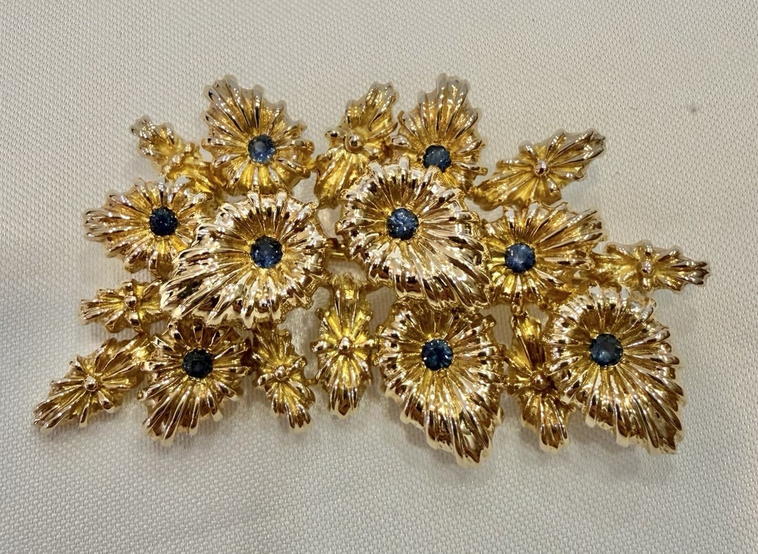 Sapphire Brooch in French 14k Yellow Gold with Hallmarks: Sapphire Brooch in French 14k Yellow Gold with Hallmarks This French brooch is crafted from 14k yellow gold and features approximately 0.50 carat of sapphire. It showcases intricate detail, design, an