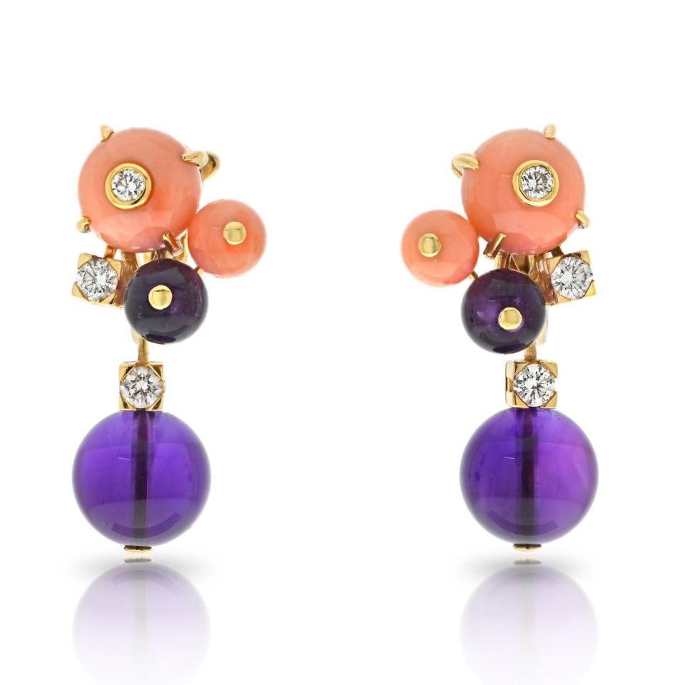 Cartier Delices de Goa 18K Yellow Gold Coral Amethyst Earrings: Cartier Delices de Goa 18K Yellow Gold Coral Amethyst Earrings Experience the allure of luxury with these exquisite Cartier Delices De Goa earrings. Crafted from 18K yellow gold, these earclips weigh