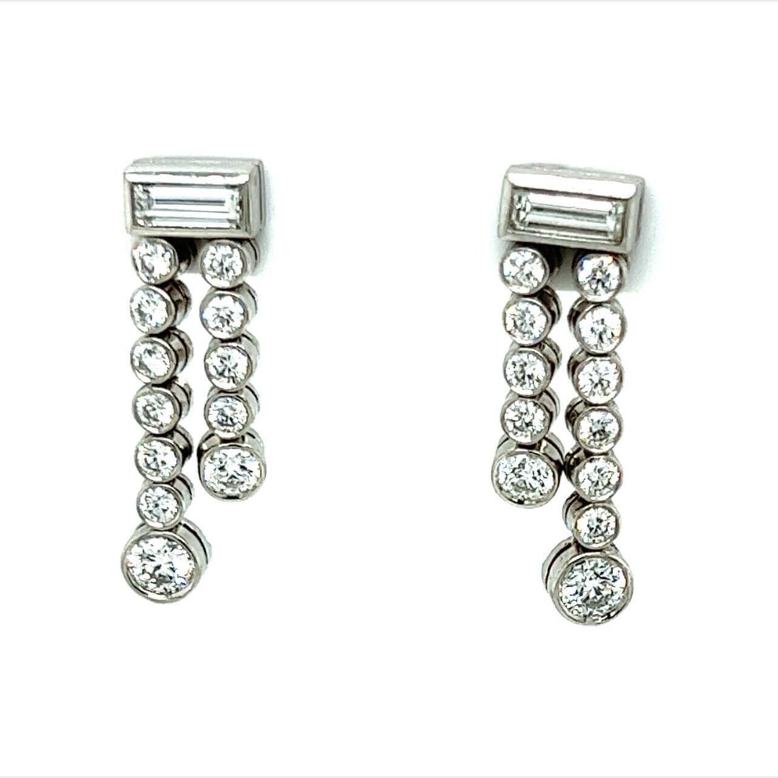 Jazz Double Row Diamond Platinum Drop Earrings by Tiffany & Co.: Jazz Double Row Diamond Platinum Drop Earrings by Tiffany & Co. These vintage Tiffany & Co. Jazz Double Row Dangle Earrings are crafted from platinum and feature double rows of sparkling diamonds tota