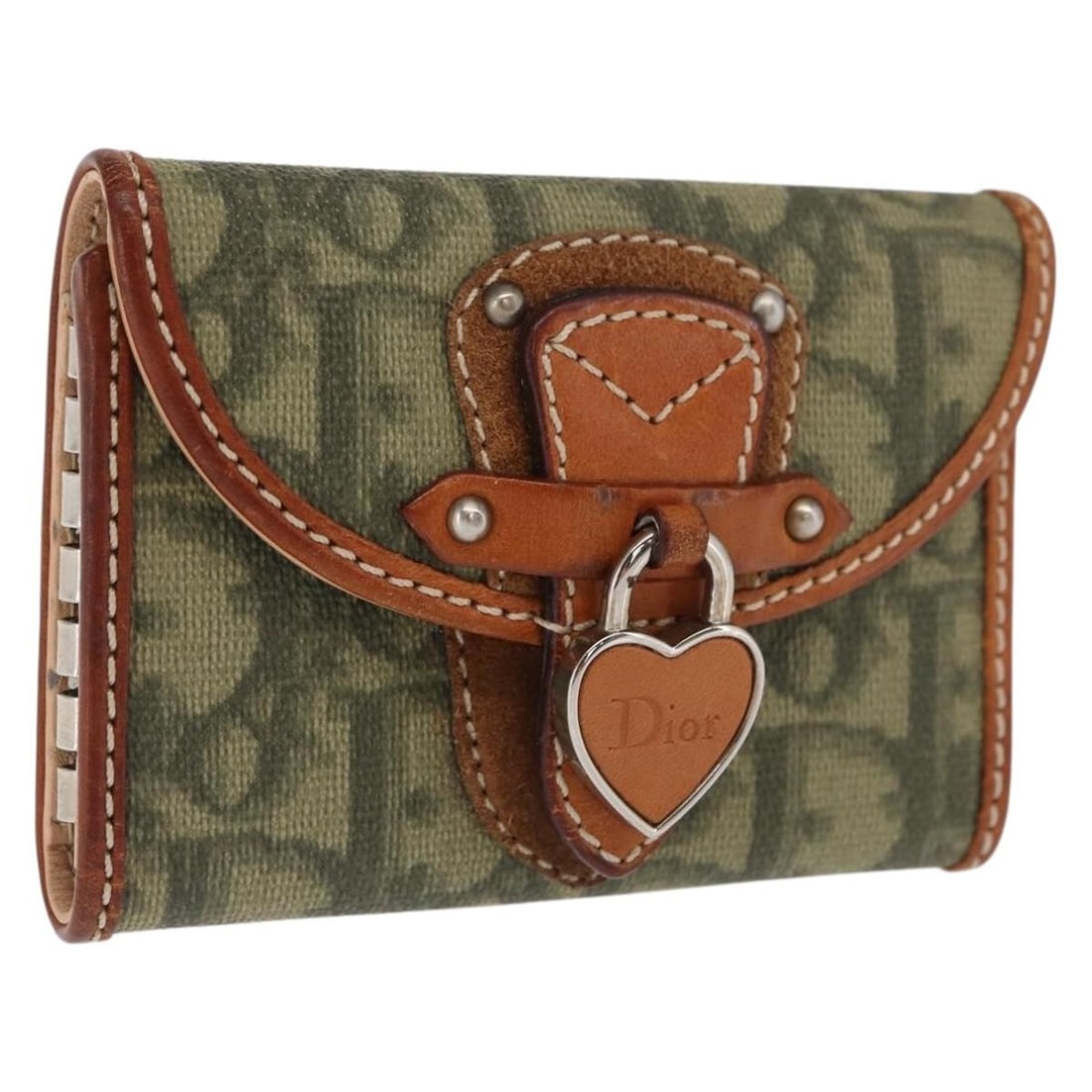 Christian Dior Khaki Silver PVC Trotter Canvas Key Case Made in Italy: Christian Dior Khaki Silver PVC Trotter Canvas Key Case Made in Italy Christian Dior key case crafted from PVC leather and Trotter canvas in khaki and silver tones. Compact design suitable for organiz