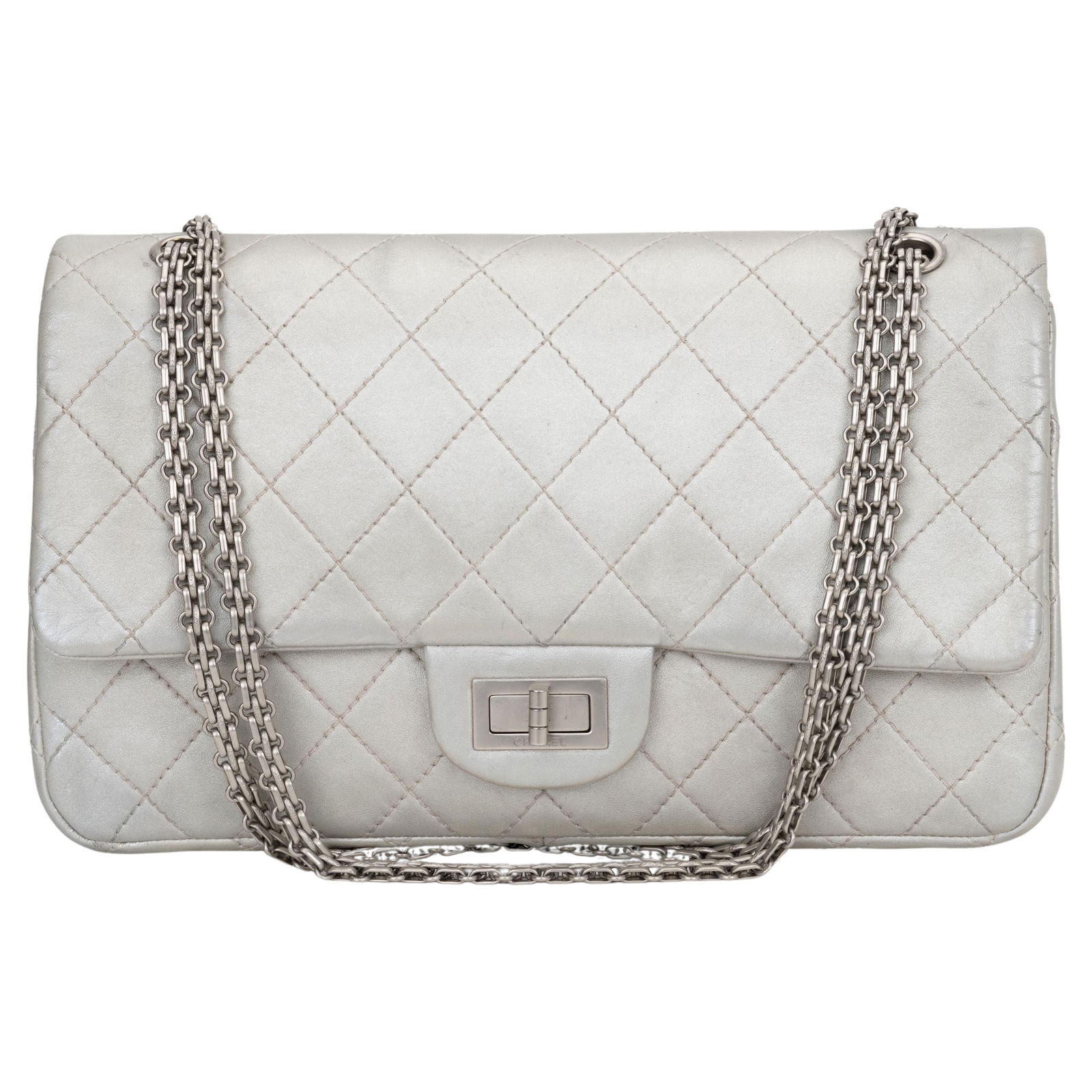Chanel Jumbo Reissue Silver Double Flap Bag with Hologram: Chanel Jumbo Reissue Silver Double Flap Bag with Hologram Introducing the Chanel Jumbo Reissue Silver Double Flap, a stunning addition to any fashion collection. This iconic bag features luxurious met