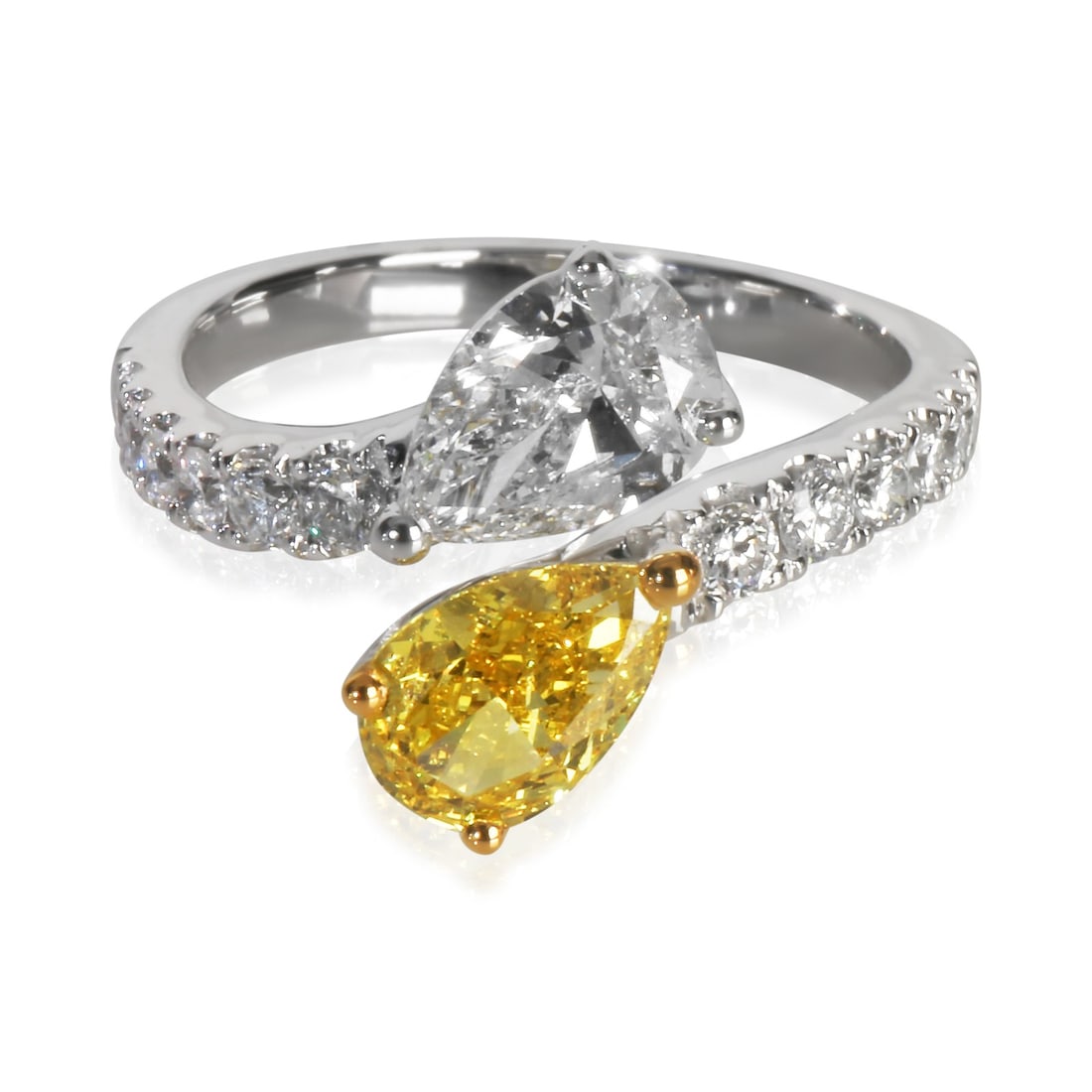 Bypass Ring in 14K White and Yellow Gold with 2.5ctw Lab Diamond: Bypass Ring in 14K White and Yellow Gold with 2.5ctw Lab Diamond This women's ring features a total of 2.5 carats of lab-grown diamonds set in 14K white and yellow gold. The main pear-shaped diamond w