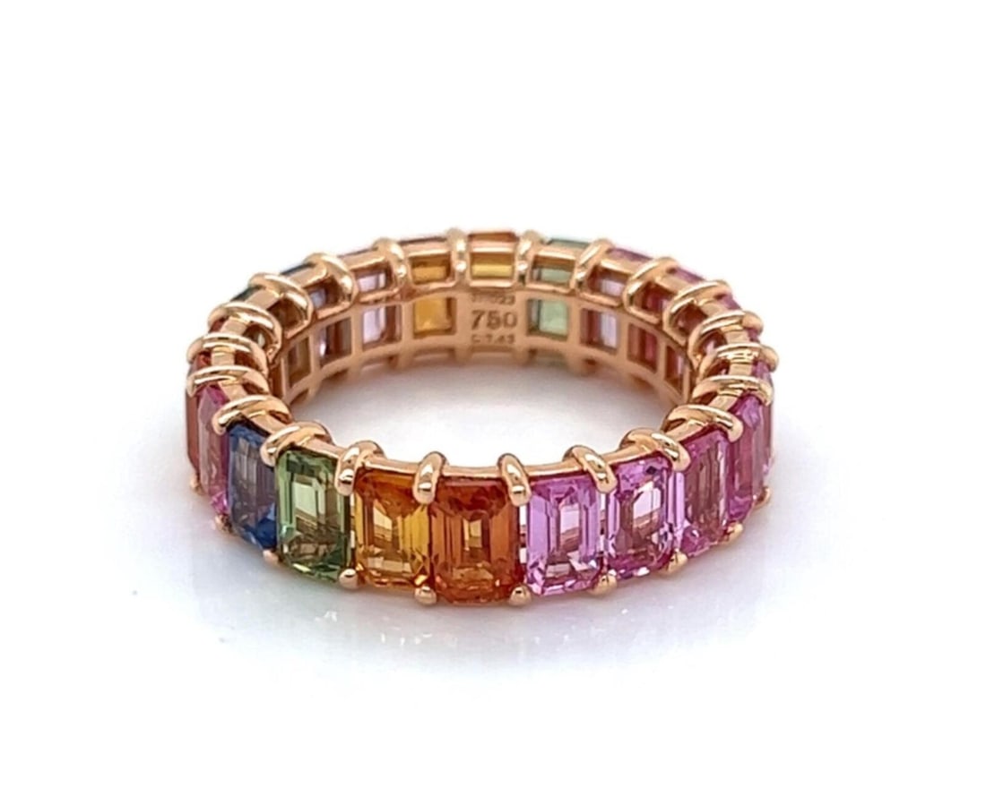 Emerald Cut Multi-Color Sapphire Eternity Band in 18k Rose Gold Size 6.5: Emerald Cut Multi-Color Sapphire Eternity Band in 18k Rose Gold Size 6.5 This band ring features a full circle of emerald cut multi-color sapphires set in 18k rose gold. The ring includes 9 pink sapph