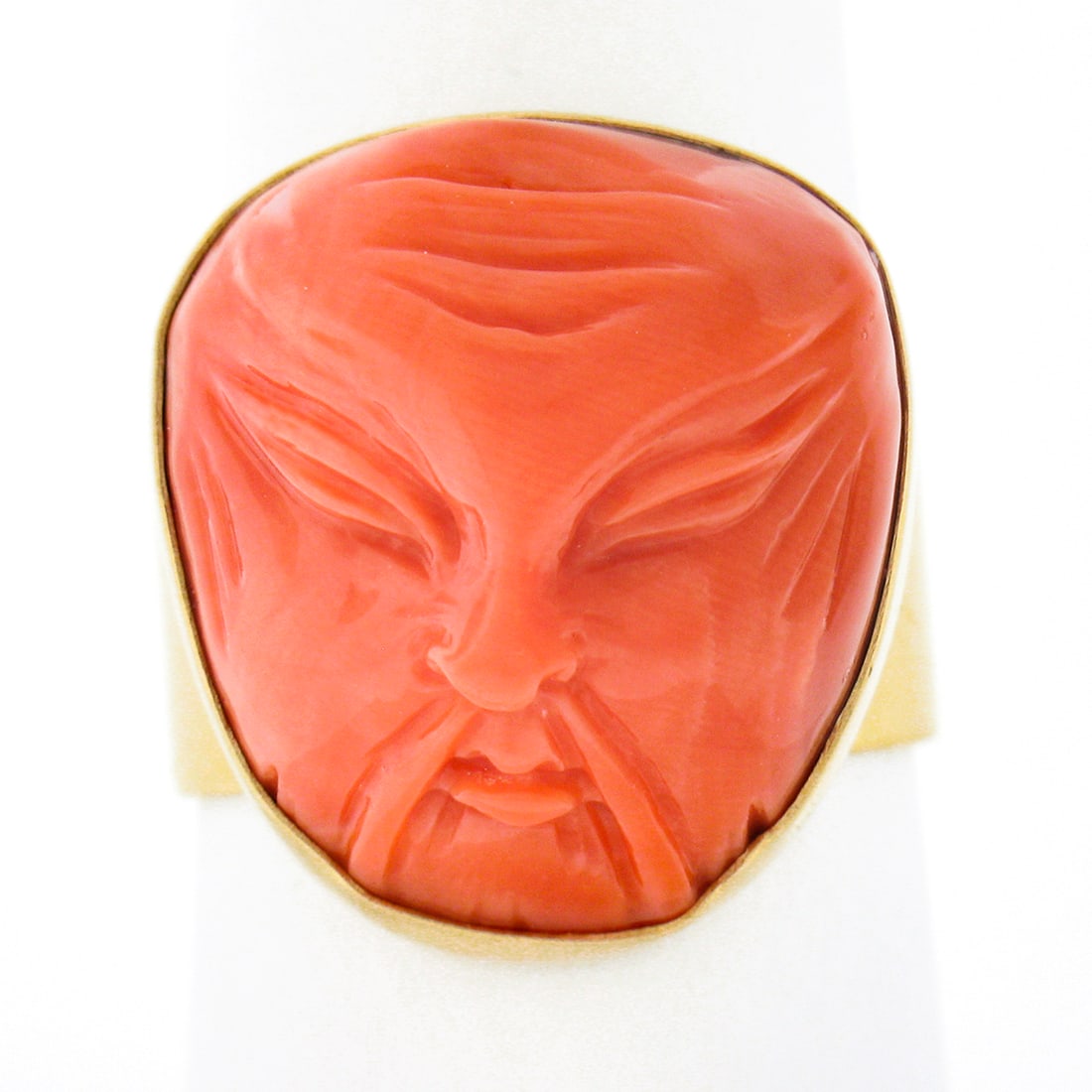 Vintage 14K Yellow Gold GIA Certified Coral Angry Asian Face Cameo Ring: Vintage 14K Yellow Gold GIA Certified Coral Angry Asian Face Cameo Ring This exquisite vintage ring showcases a stunning GIA certified natural coral carved into an intricate angry Asian face. Crafted