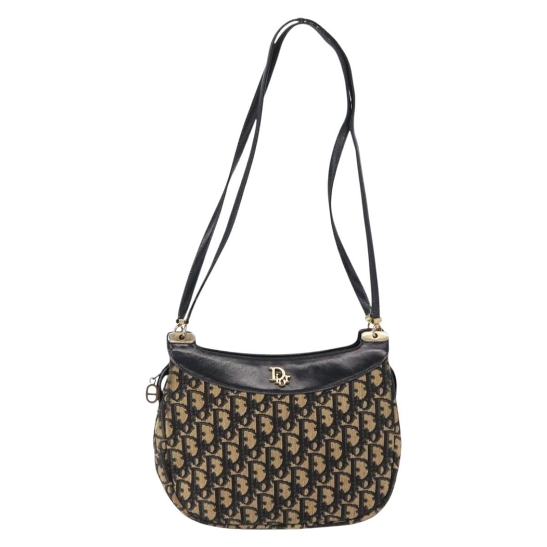 Navy Canvas Vintage Trotter Shoulder Bag by Christian Dior: Navy Canvas Vintage Trotter Shoulder Bag by Christian Dior Christian Dior Vintage Trotter shoulder bag for women crafted in navy canvas. The bag features leather accents and metal fittings. It shows s