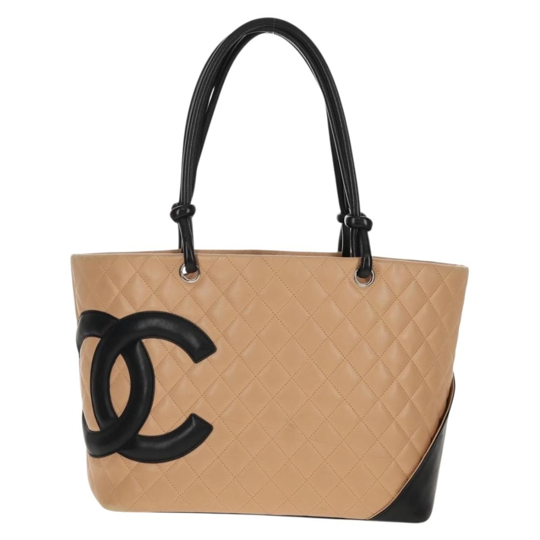 Chanel Beige Leather Cambon Tote Bag 29cm by 24cm by 15cm: Chanel Beige Leather Cambon Tote Bag 29cm by 24cm by 15cm The Chanel Cambon Tote is crafted from beige leather, designed for women. This handbag features a quilted exterior with metal fittings. It sho