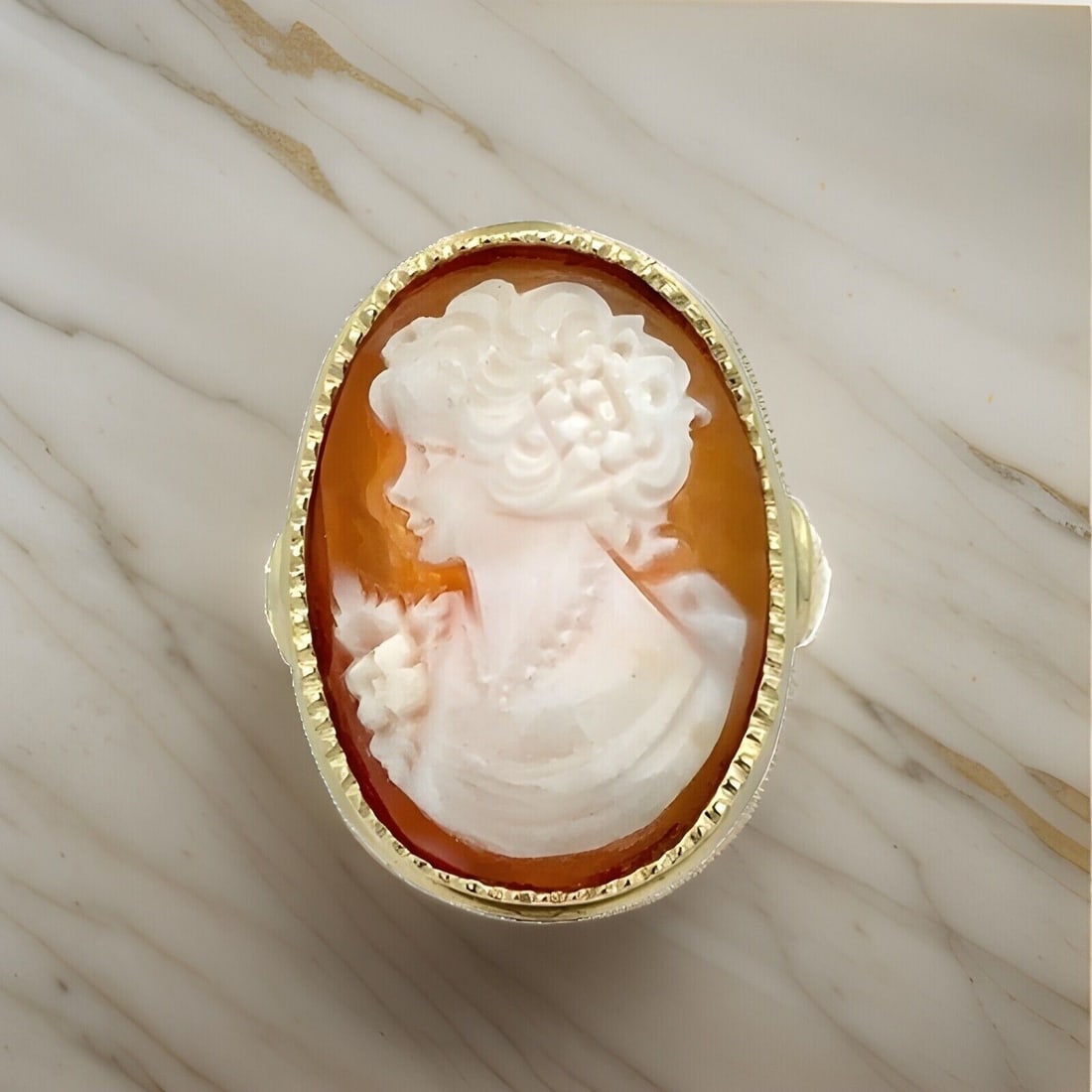 Vintage Retro 14k Gold Oval Carved Shell Cameo Cocktail Ring: Vintage Retro 14k Gold Oval Carved Shell Cameo Cocktail Ring This exquisite Vintage Retro Cocktail Ring features a stunning large oval carved shell cameo set in a solid 14k yellow gold bezel with a mi