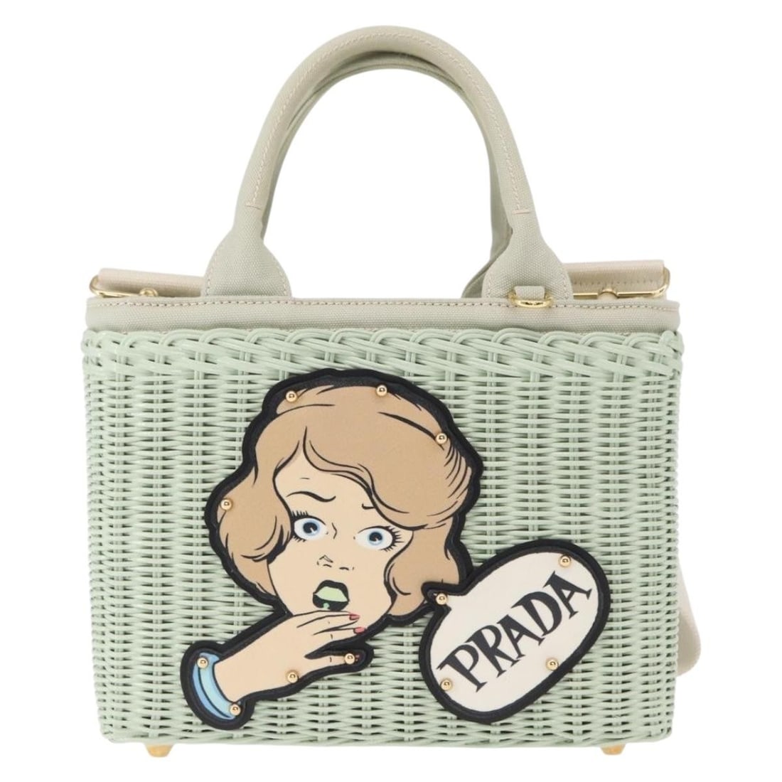 Prada Comic Basket Wicker Crossbody Bag in Green: Prada Comic Basket Wicker Crossbody Bag in Green This Prada Comic Basket Bag for women features a green wicker construction with an applique design. It offers a stylish and unique accessory option wit