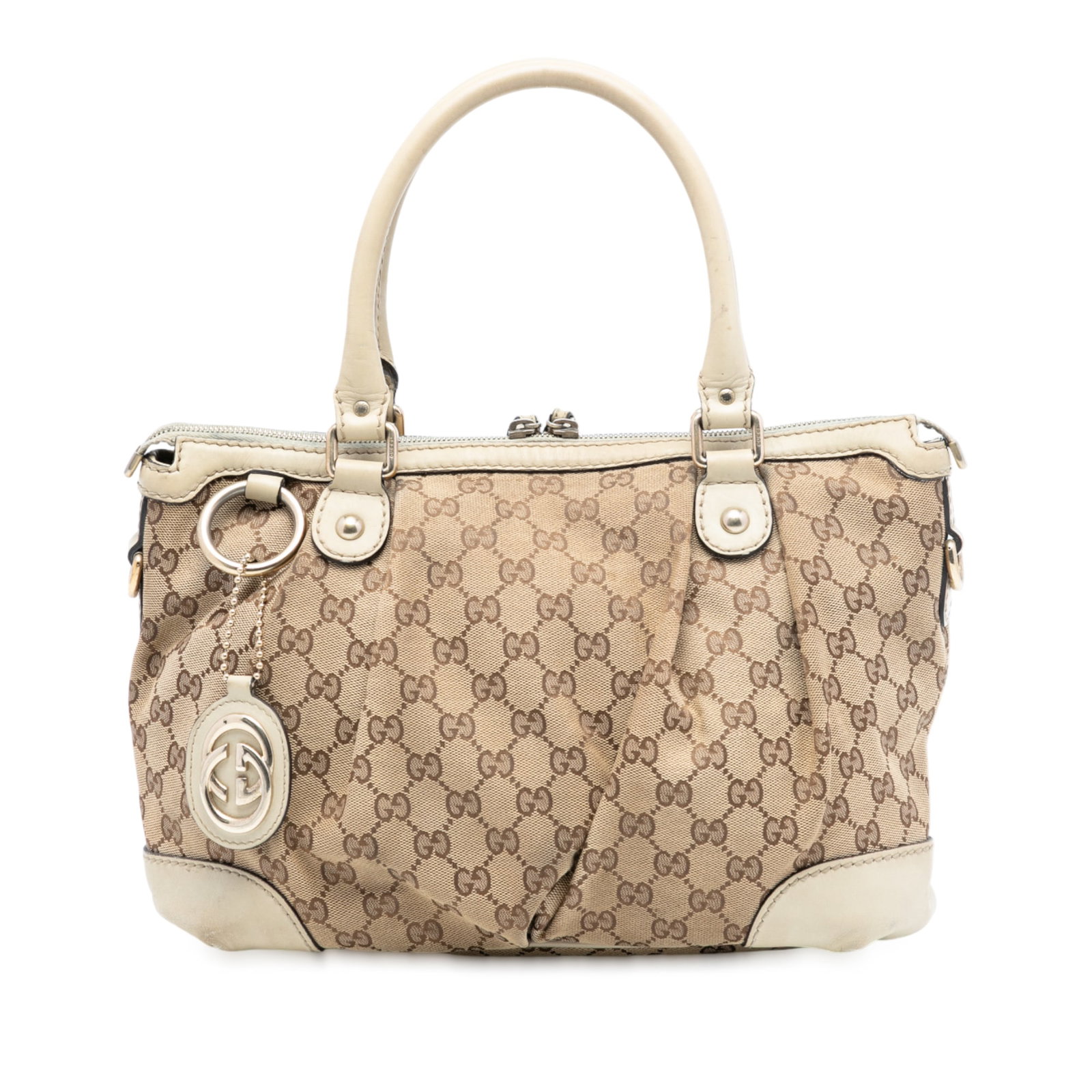 Brown GG Canvas Sukey Satchel Bag by Gucci with Leather Trim: Brown GG Canvas Sukey Satchel Bag by Gucci with Leather Trim This Gucci GG Canvas Sukey Satchel features a brown canvas body with leather trim, rolled leather handles, a top zip closure, and interior