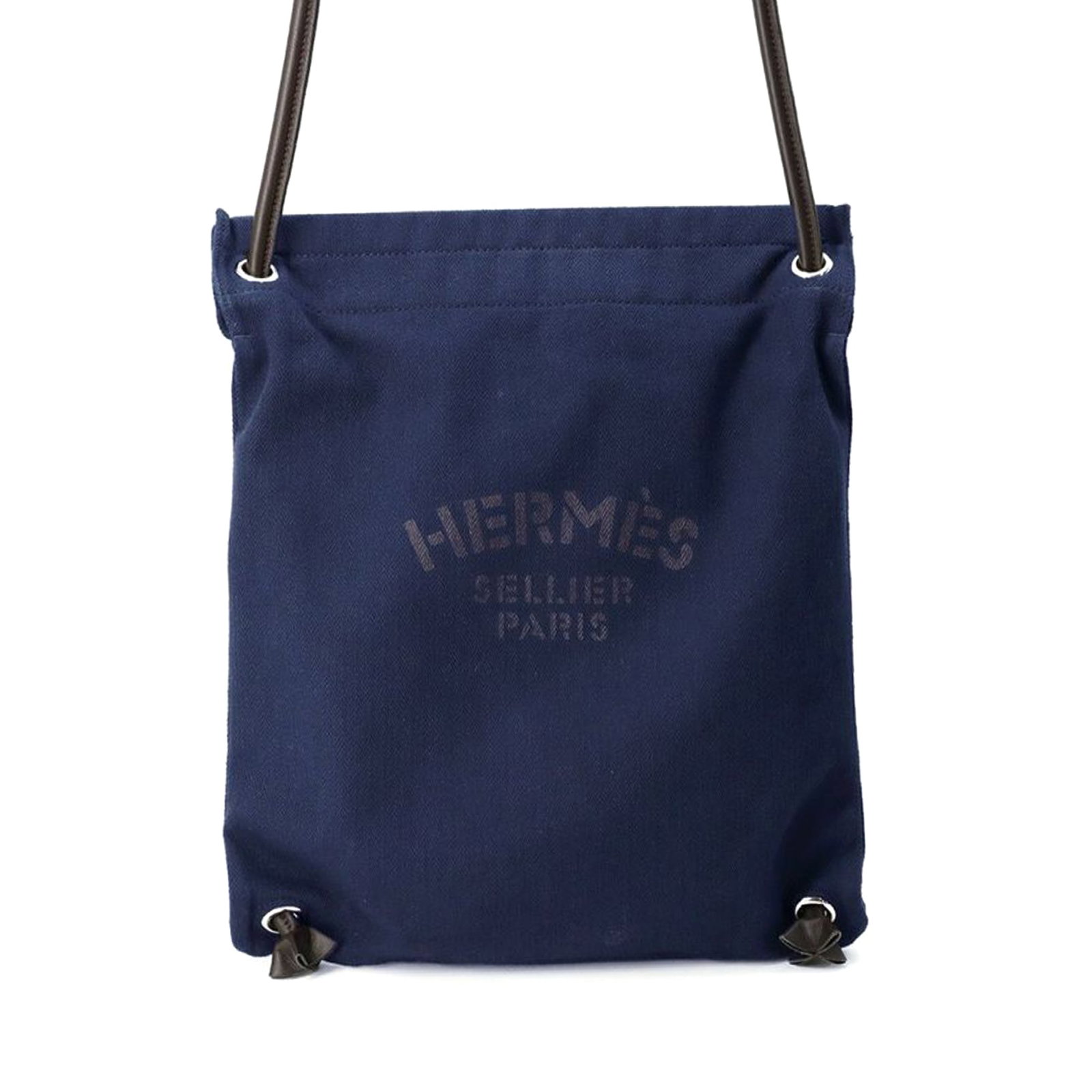 Hermes Toile Aline Canvas Blue Bag with Leather Strap: Hermes Toile Aline Canvas Blue Bag with Leather Strap This Hermes Toile Aline Grooming Bag features a blue canvas body with a rolled leather strap and an open top. The bag presents with some creasing