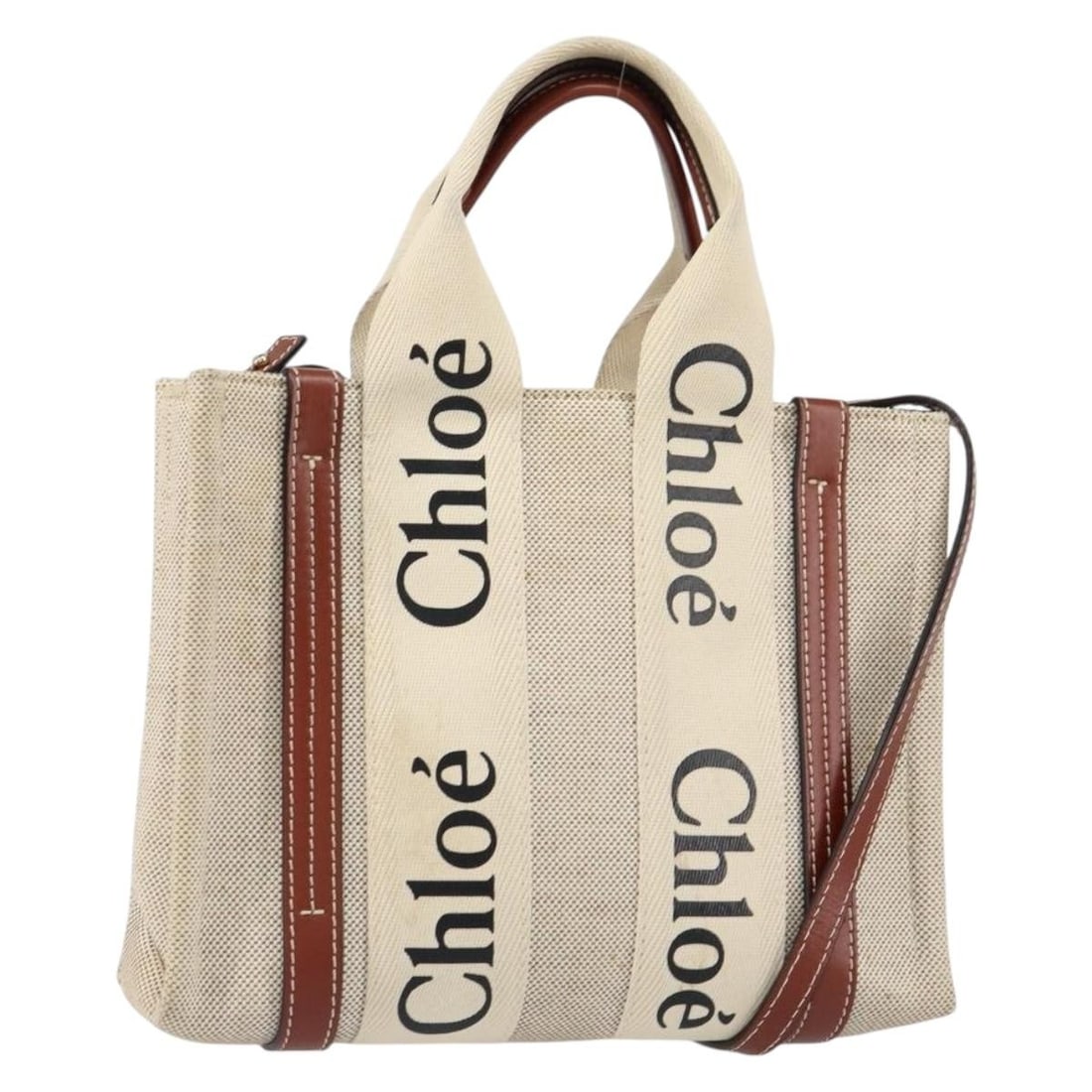 Chloe Woody Convertible Beige Canvas Leather Tote Bag 26cm: Chloe Woody Convertible Beige Canvas Leather Tote Bag 26cm This pre-owned Chloe Woody Convertible Tote features beige canvas with leather accents, designed for women. The handbag has a convertible sty