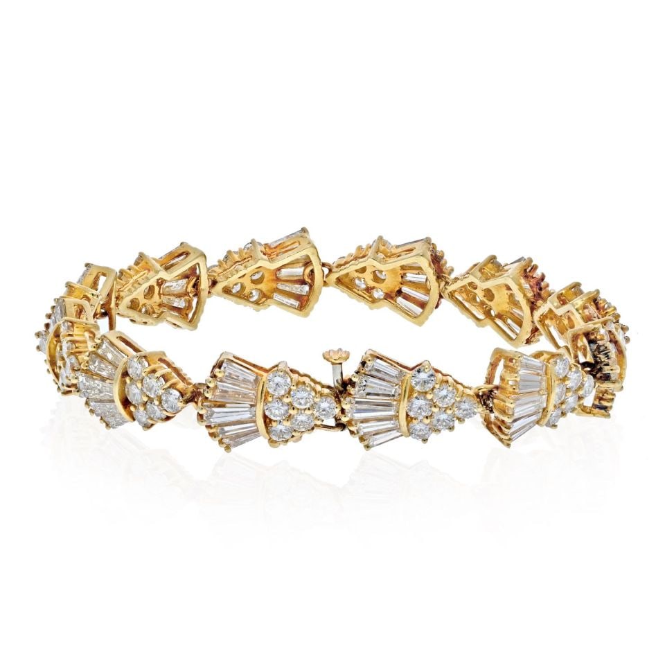14K Yellow Gold Estate Bracelet 13.50 Carat Diamond Rounds Baguettes: 14K Yellow Gold Estate Bracelet 13.50 Carat Diamond Rounds Baguettes This exquisite estate bracelet is crafted from 14K yellow gold and features a stunning array of round and baguette cut diamonds, to