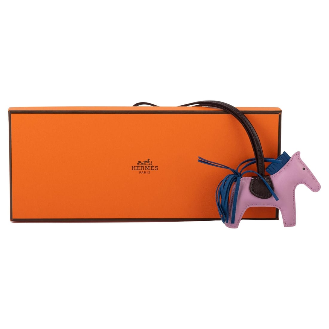 Hermes Rodeo Small Bag Charm Mauve Blue New in Box: Hermes Rodeo Small Bag Charm Mauve Blue New in Box Elevate your accessories with this exquisite Hermes Rodeo Small bag charm, featuring a stunning combination of mauve blue, rouge, and bleu colors. De