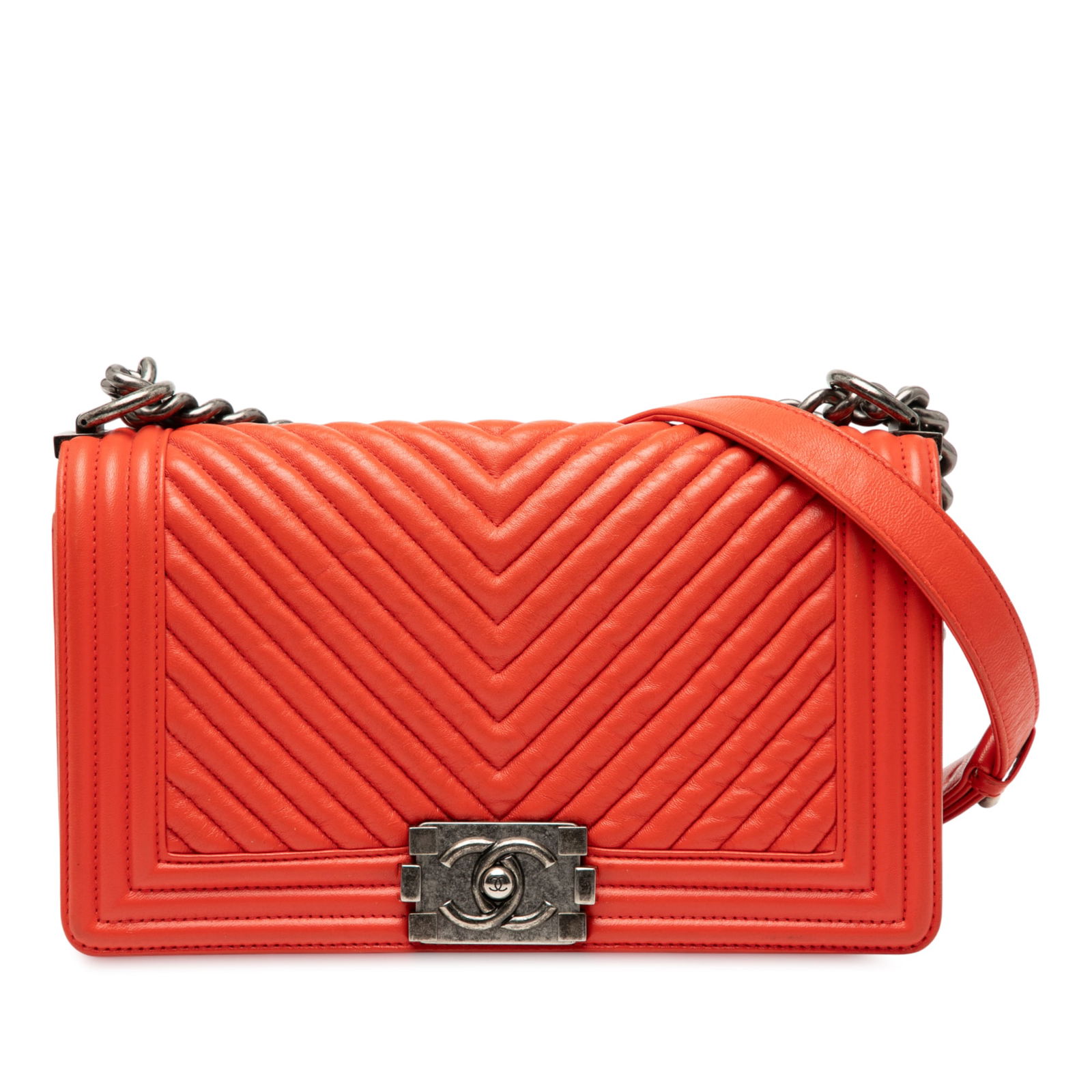 Chanel Old Medium Boy Flap Red Chevron Lambskin Bag: Chanel Old Medium Boy Flap Red Chevron Lambskin Bag This stylish Chanel Old Medium Chevron Boy Flap bag is crafted from luxurious quilted lambskin leather in a striking red color. The bag features a c