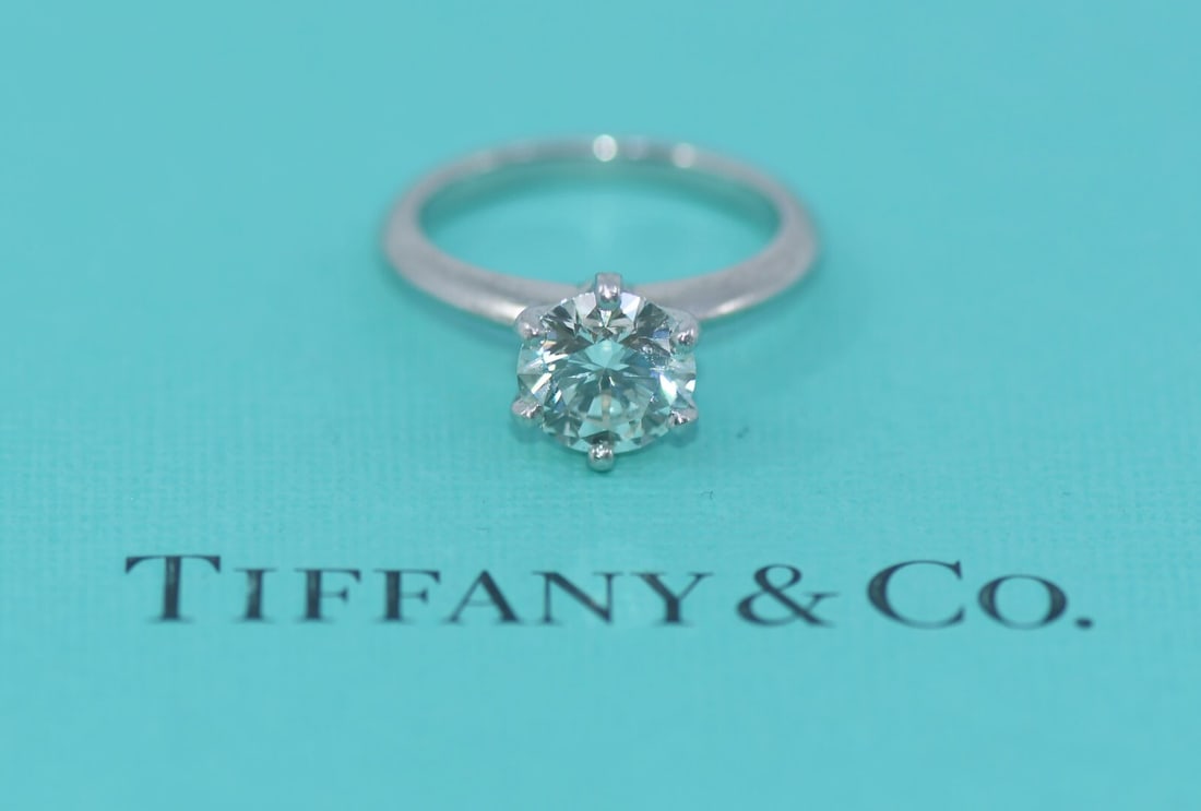 Tiffany & Co Platinum Engagement Ring 1.74 Carat Round Diamond Size 5.5: Tiffany & Co Platinum Engagement Ring 1.74 Carat Round Diamond Size 5.5 This exquisite engagement ring by Tiffany & Co. features a stunning 1.74 carat round diamond, graded I color and VVS2 clarity, s