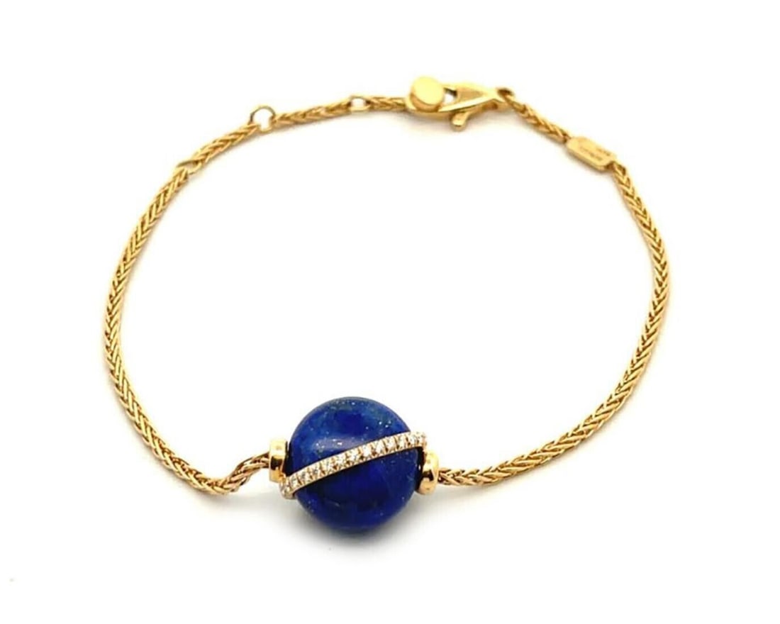 Lapis and Diamond 18k Yellow Gold Baie De Anges Bracelet by Fred of Paris: Lapis and Diamond 18k Yellow Gold Baie De Anges Bracelet by Fred of Paris This Fred of Paris Baie De Anges bracelet features an elegant design crafted from 18k yellow gold. The bracelet is adorned wit