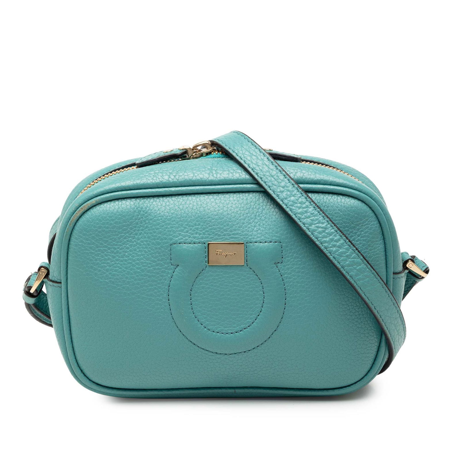 Blue Leather Crossbody Ferragamo Gancini Camera Bag with Adjustable Strap: Blue Leather Crossbody Ferragamo Gancini Camera Bag with Adjustable Strap This Ferragamo Leather Gancini Camera Bag is crafted from blue leather and features a crossbody design with an adjustable flat