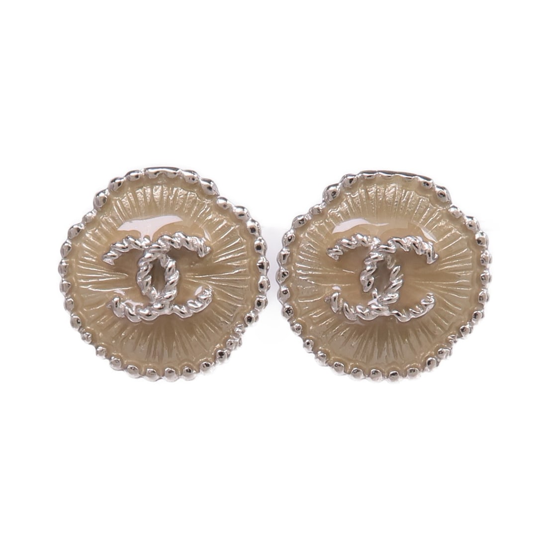 Silver Metal Pierced Earrings by CHANEL with CC Logo: Silver Metal Pierced Earrings by CHANEL with CC Logo These CHANEL CC earrings feature a pierced design crafted in silver-toned metal. The earrings showcase the iconic CC logo and are designed without