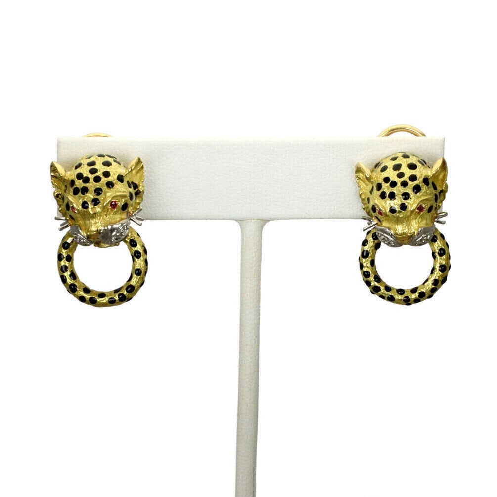18k Gold Leopard Door Knocker Earrings with Diamonds Rubies and Enamel: 18k Gold Leopard Door Knocker Earrings with Diamonds Rubies and Enamel These vintage dangle/drop earrings feature a distinctive leopard motif crafted in 18k yellow and white gold, adorned with detaile
